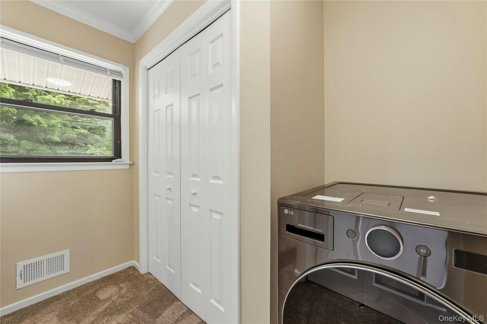 Dressing area with window and this second large closet Dressing area with window and this second large closet