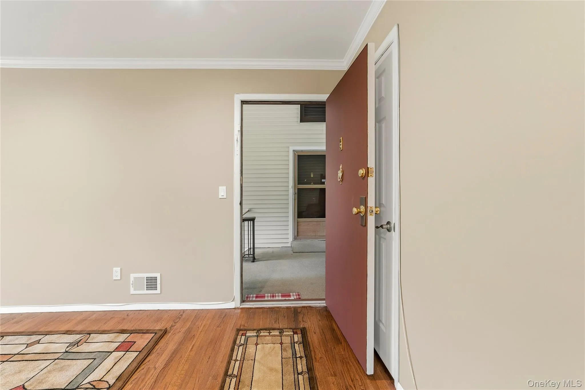 Enter into the living area with coat closet on right Enter into the living area with coat closet on right