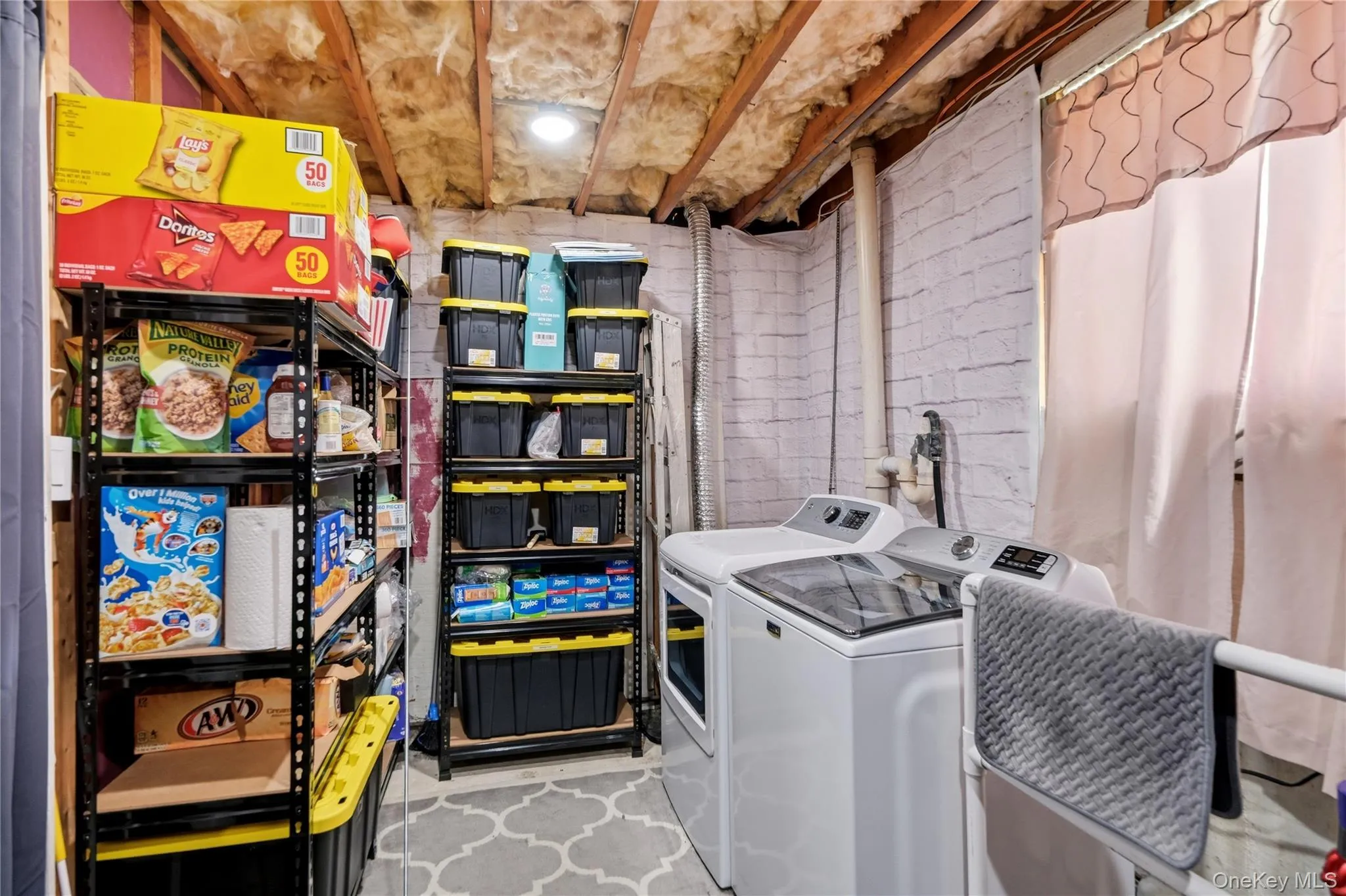 Dedicated laundry area featuring a washer and dryer Dedicated laundry area featuring a washer and dryer