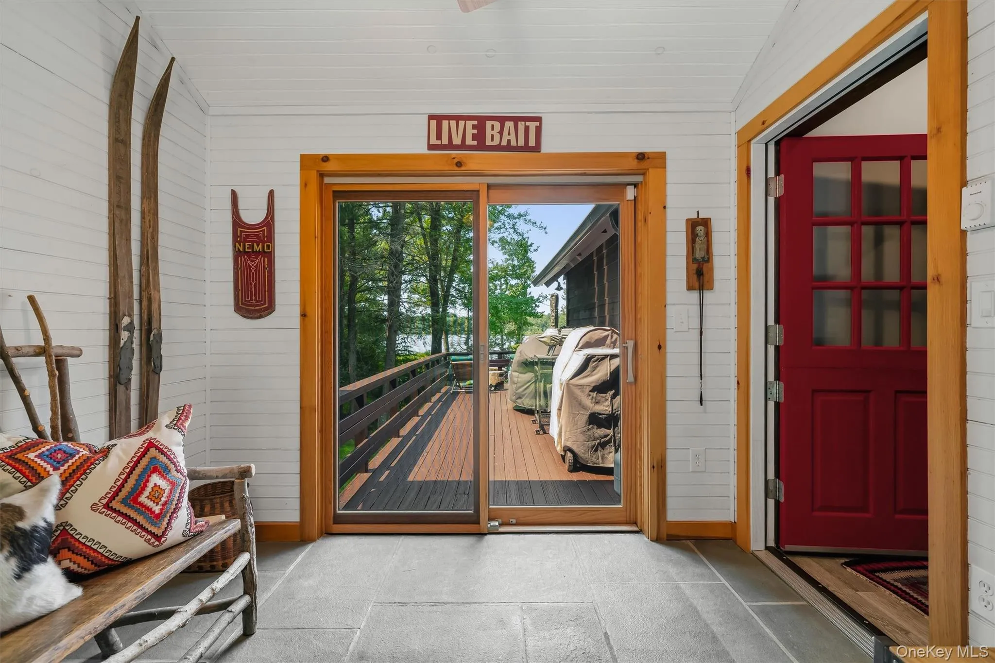 Entry with view to the lake and door to deck Entry with view to the lake and door to deck