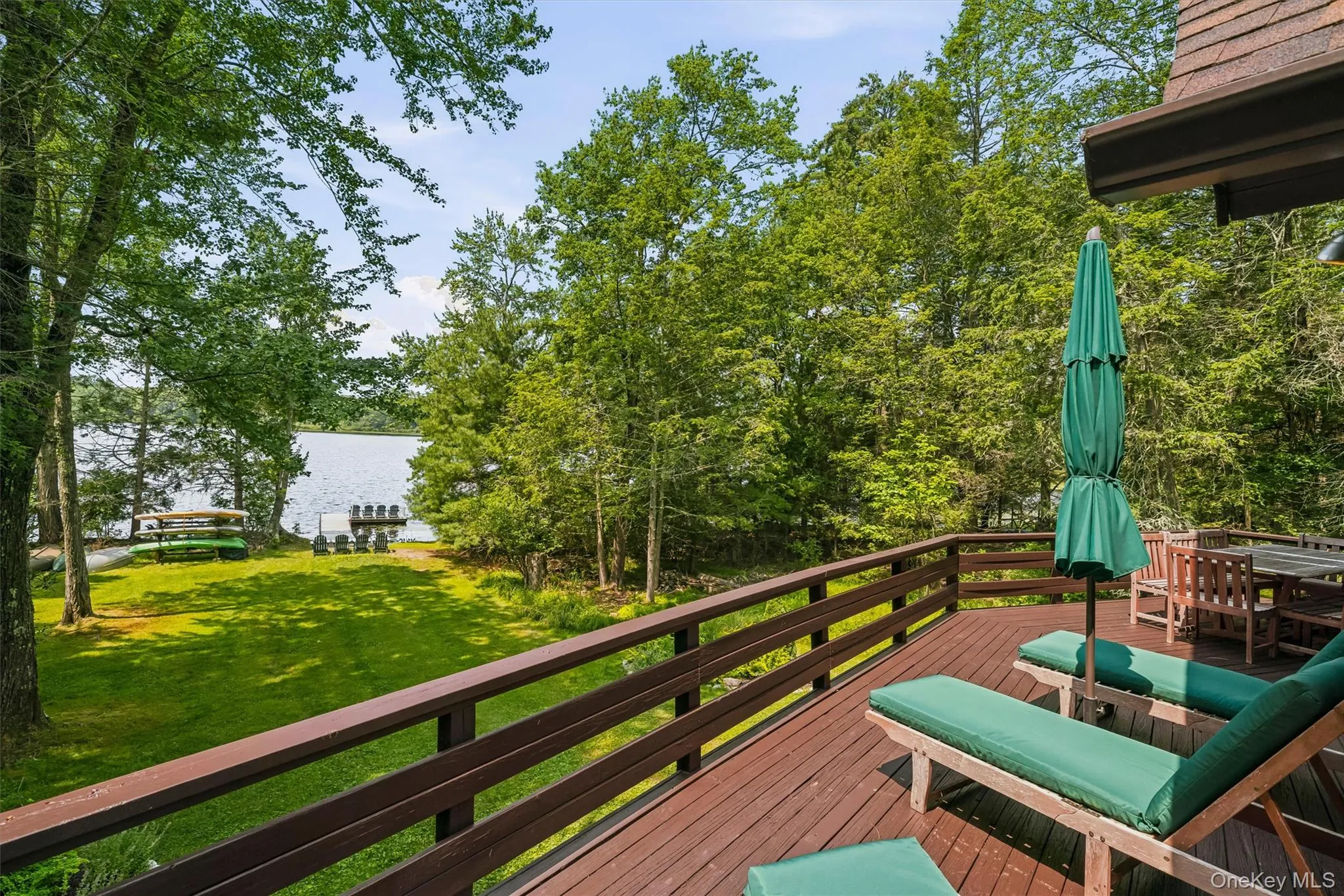back deck with yard and lake views back deck with yard and lake views
