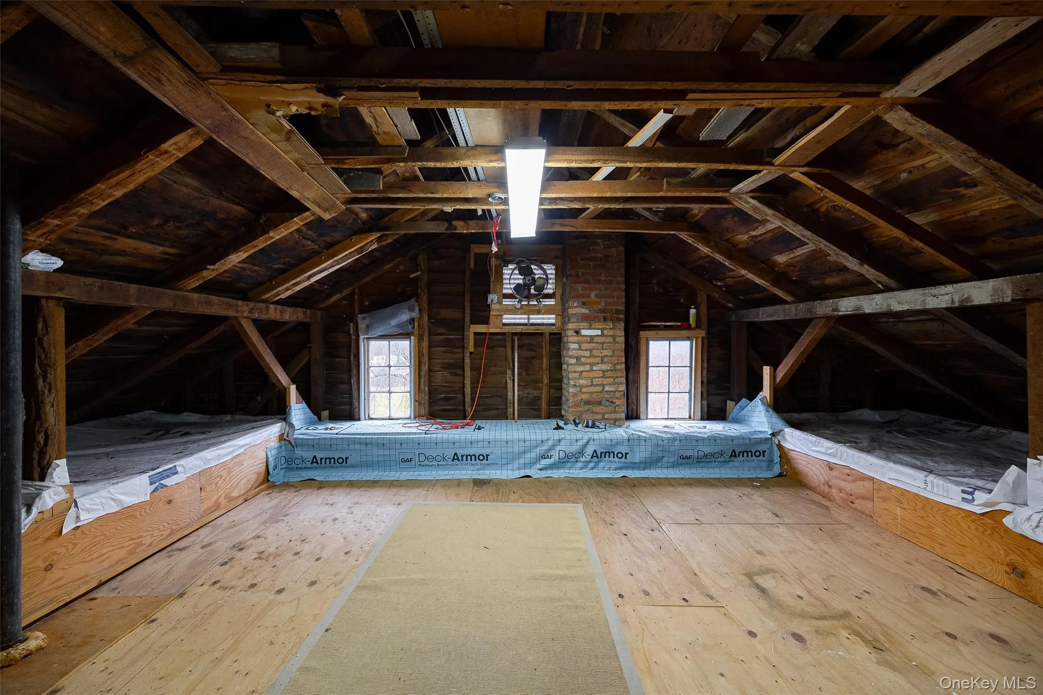 Attic with healthy amount of natural light Attic with healthy amount of natural light