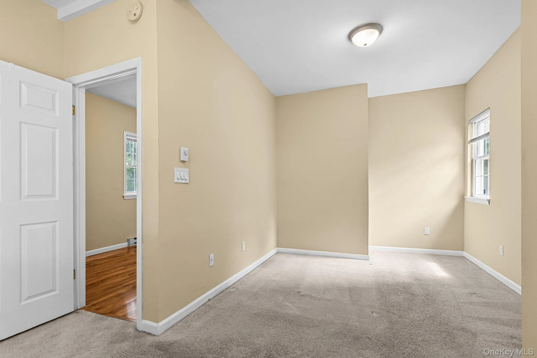 Neutral-toned walls and light-colored carpeting define this bedroom. Built-in closet and previously accomodated a Queen size bedroom set. Neutral-toned walls and light-colored carpeting define this bedroom. Built-in closet and previously accomodated a Queen size bedroom set.
