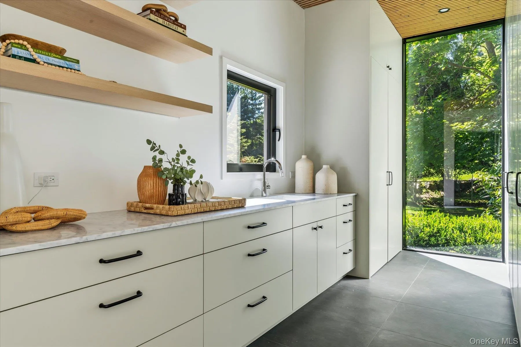 Mudroom/Laundry Room with extensive storage and additional preparation area Mudroom/Laundry Room with extensive storage and additional preparation area