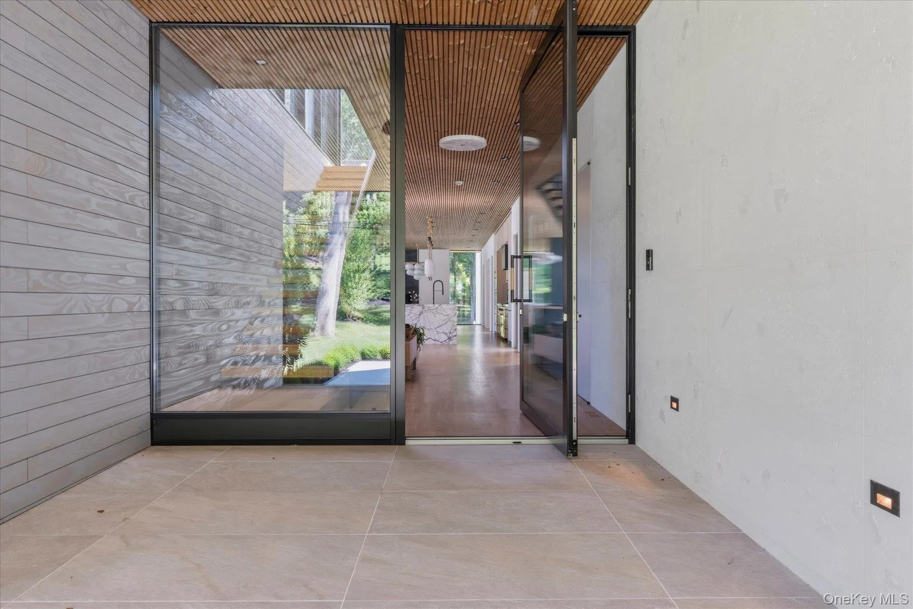 Hanover Porcelain Pavers lead to Floor to Ceiling Glass Door Hanover Porcelain Pavers lead to Floor to Ceiling Glass Door