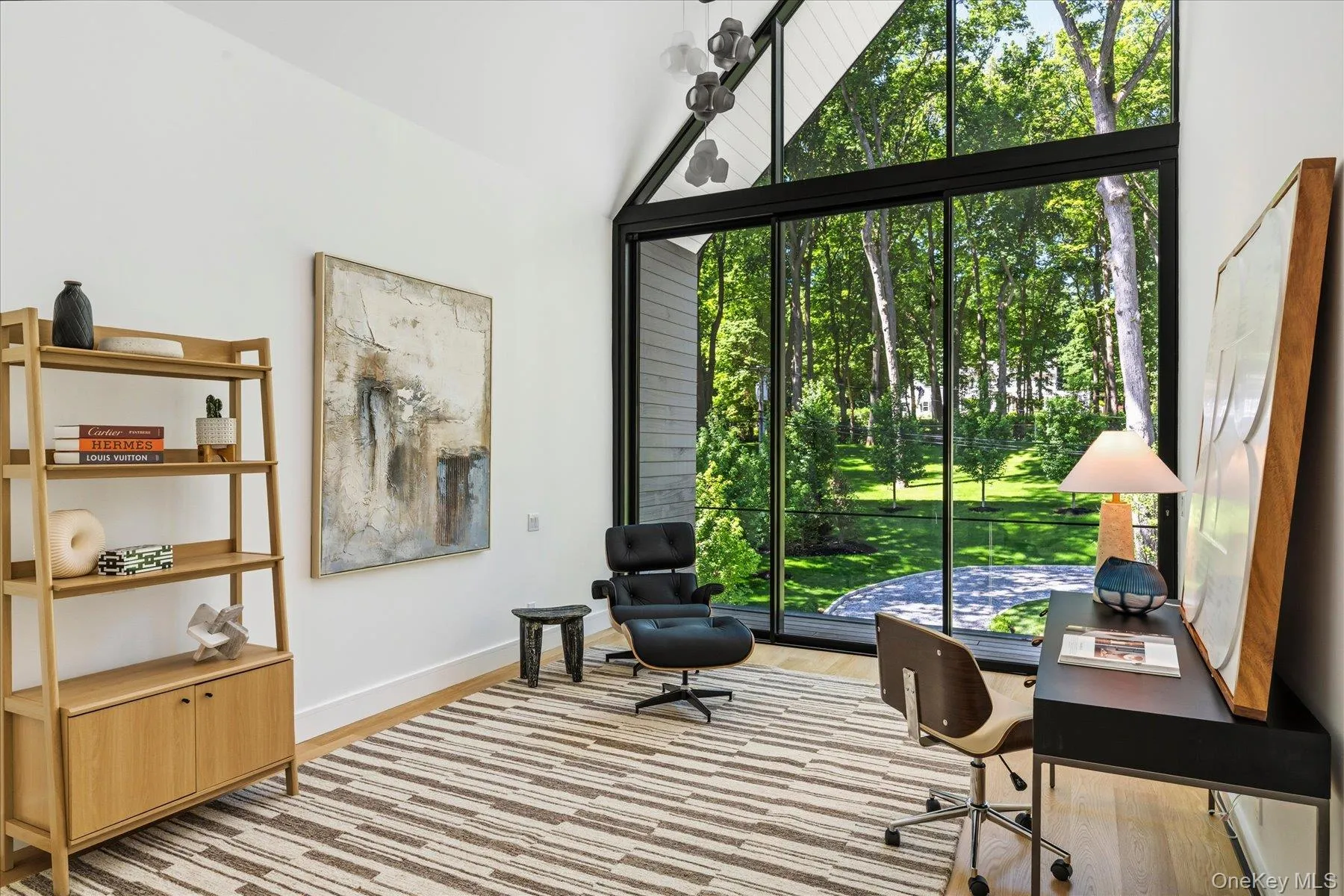 Second floor bedroom with floor to ceiling windows and outdoor access to balcony with water views Second floor bedroom with floor to ceiling windows and outdoor access to balcony with water views