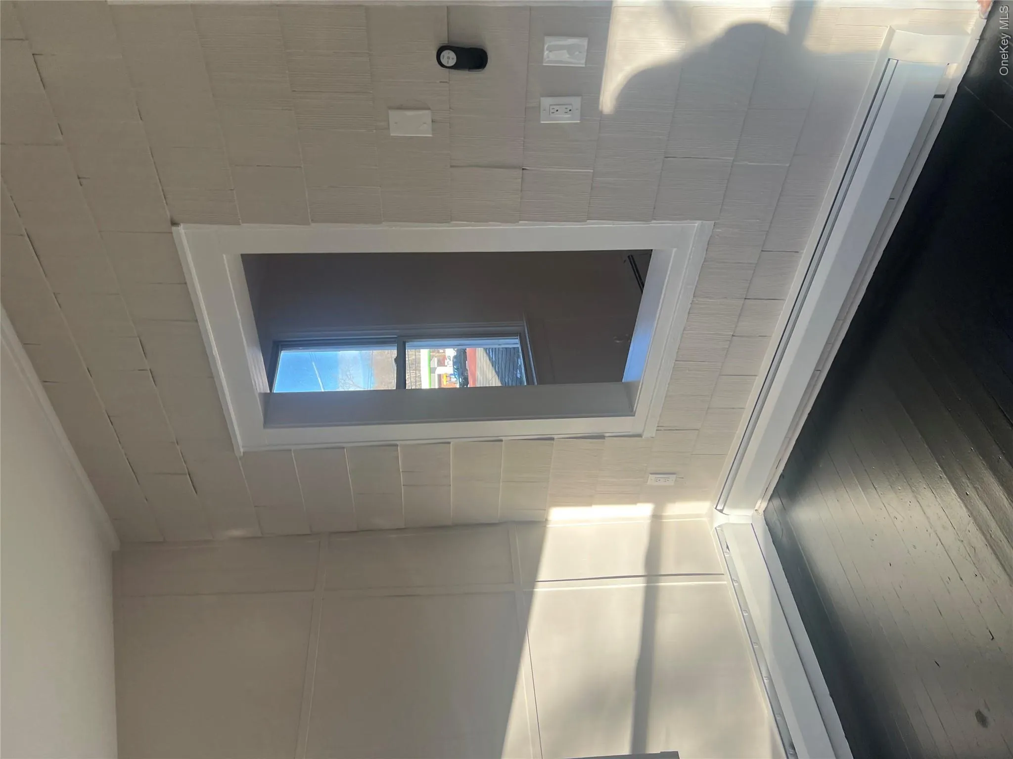 Apartment #2 Living room with ceiling fan, dark floors, backstair entrance to apartment #2 - Apartment #2 Living room with ceiling fan, dark floors, backstair entrance to apartment #2 -