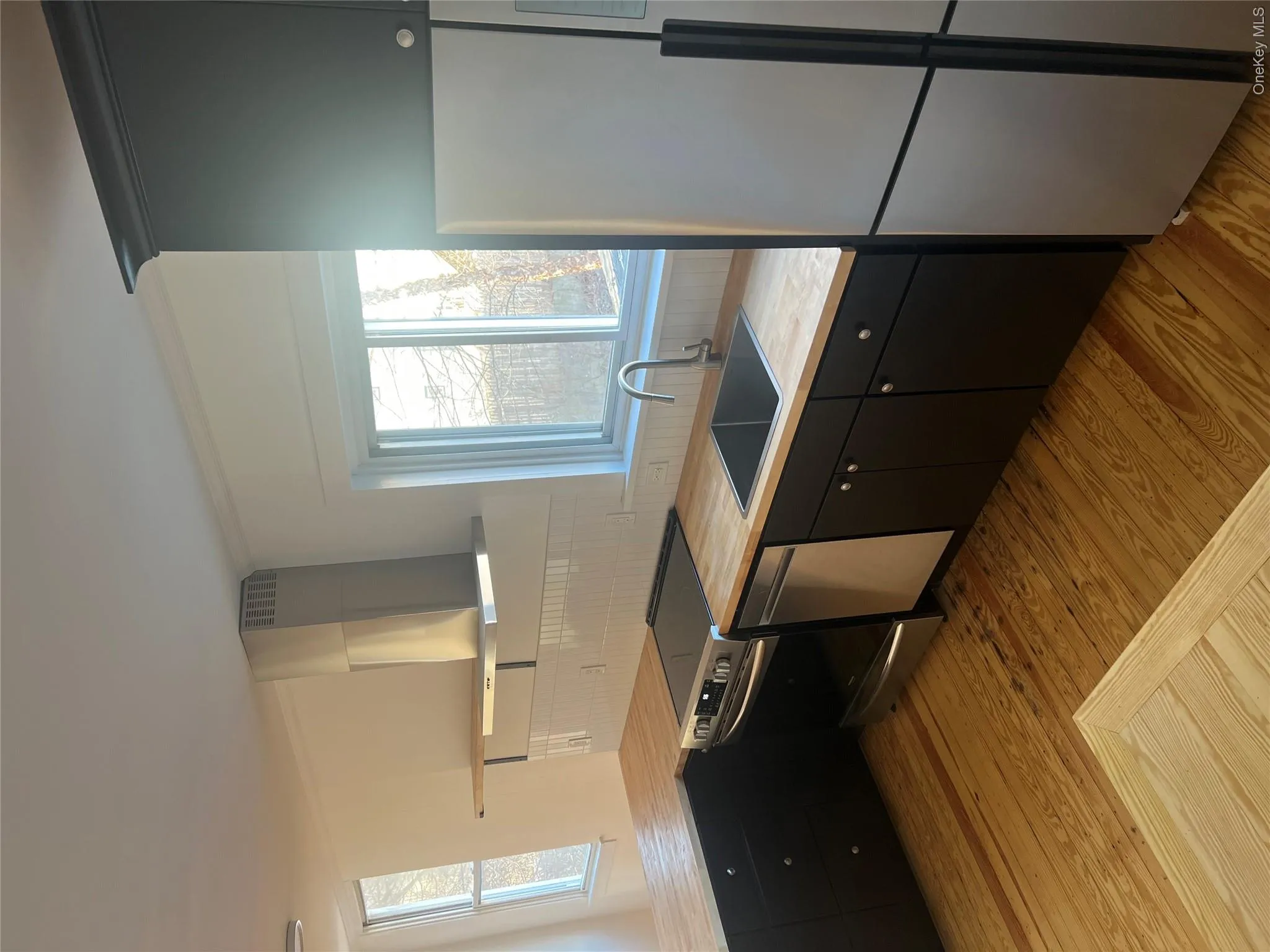 Apartment #2 - another view of the updated kitchen with wood floors Apartment #2 - another view of the updated kitchen with wood floors