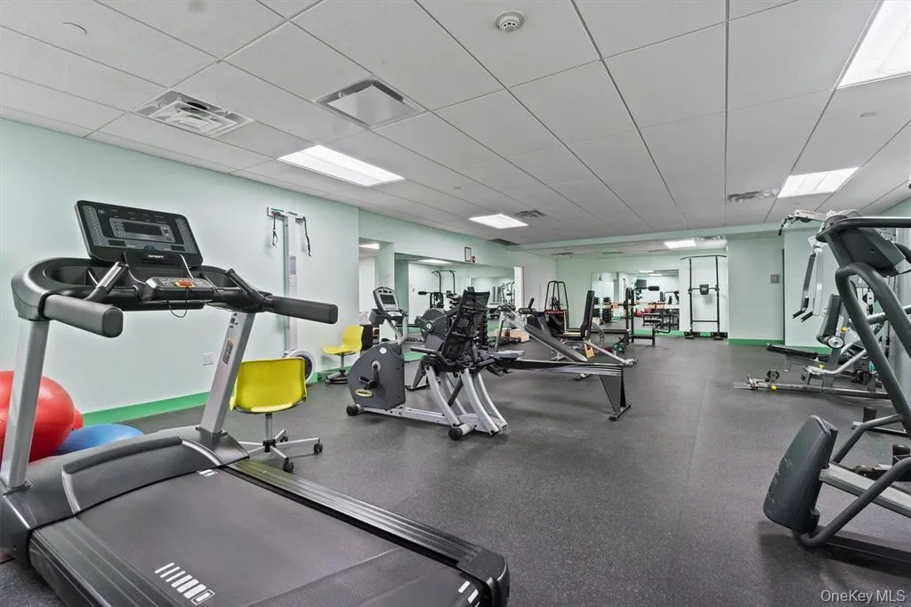 Exercise room featuring a drop ceiling Exercise room featuring a drop ceiling