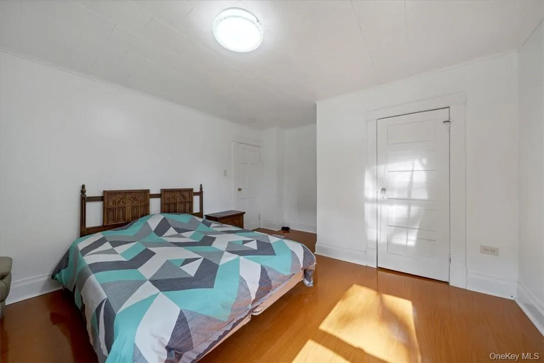 Bedroom with hardwood / wood-style flooring Bedroom with hardwood / wood-style flooring
