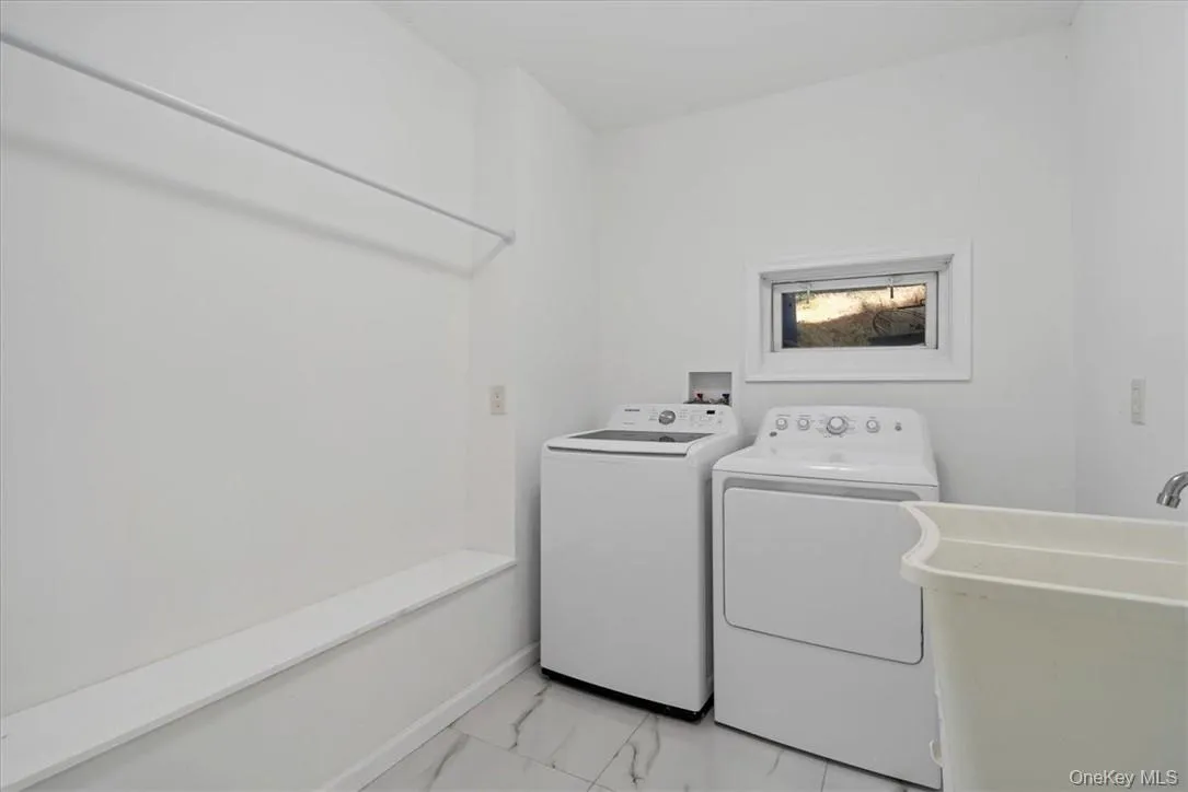 Clothes washing area with independent washer and dryer and sink Clothes washing area with independent washer and dryer and sink