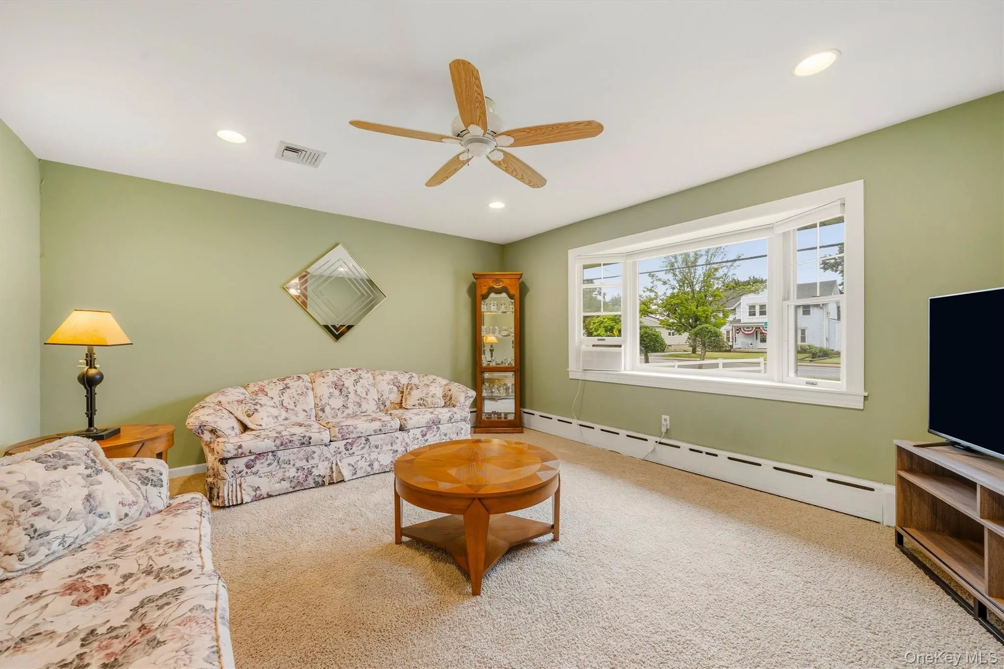 Living Room with Ceiling fan and picture window Living Room with Ceiling fan and picture window
