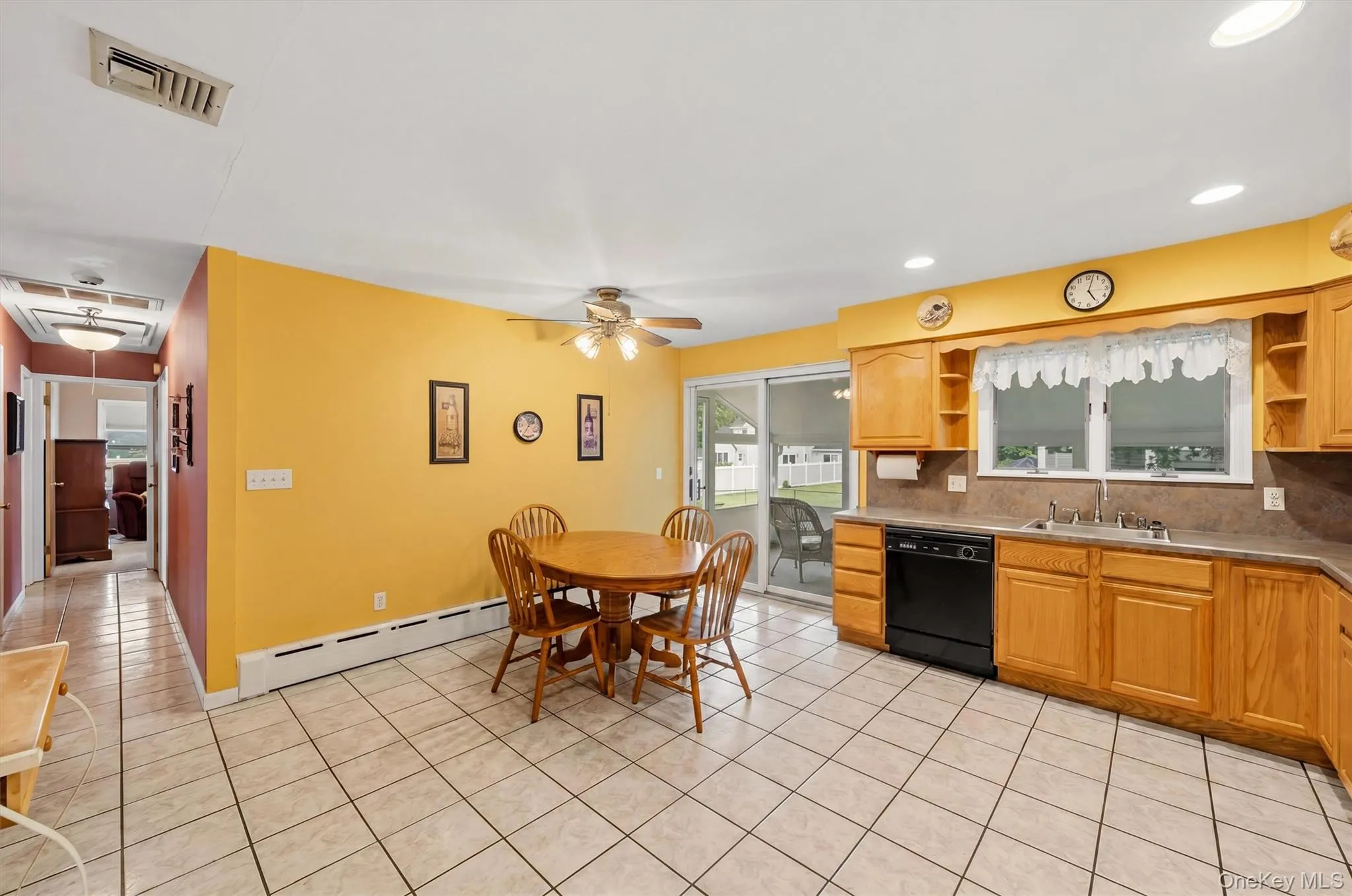Kitchen, hallway and sliders to screened in porch Kitchen, hallway and sliders to screened in porch