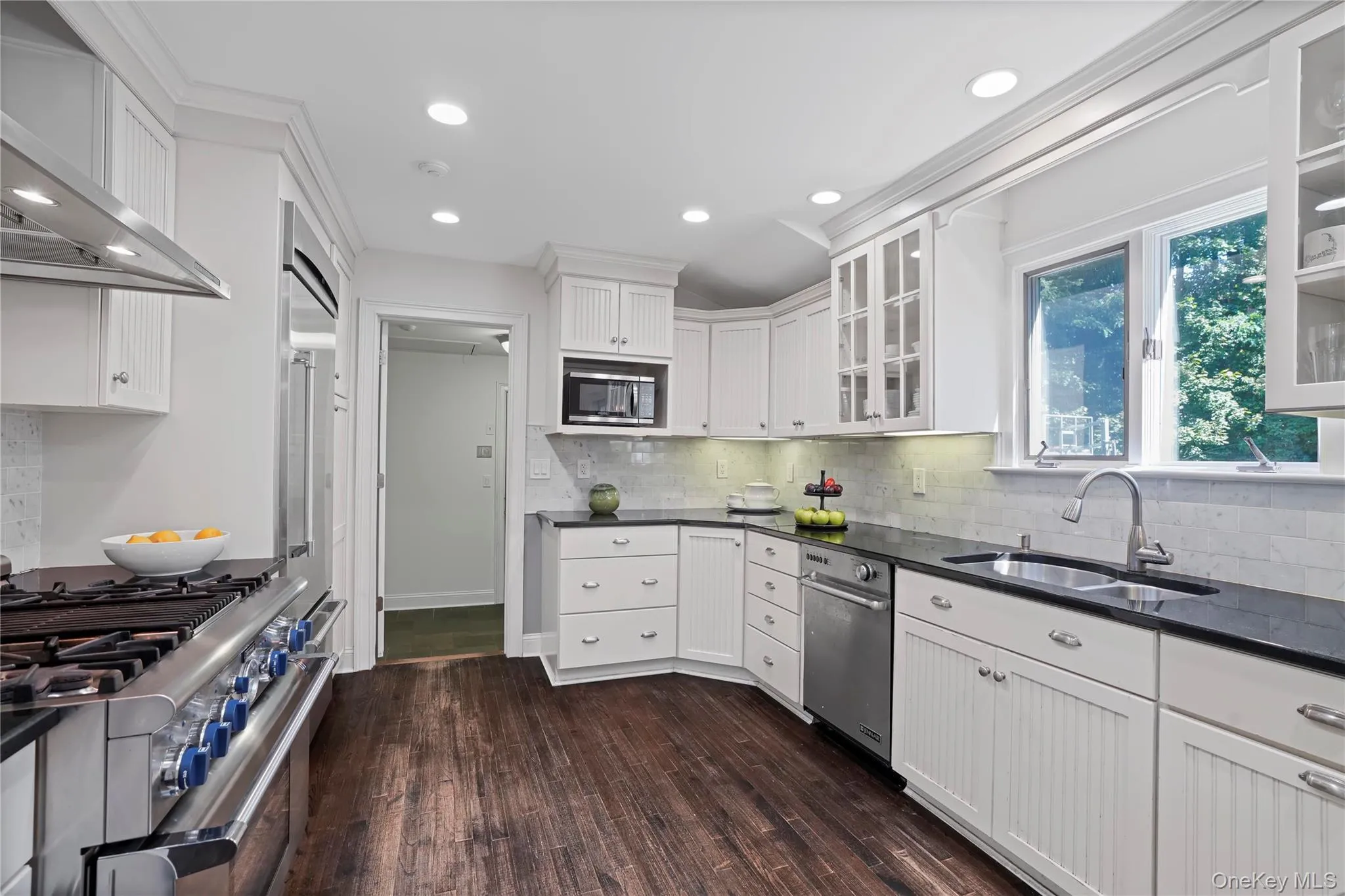 Kitchen out to mudroom entrance, laundry and family room Kitchen out to mudroom entrance, laundry and family room