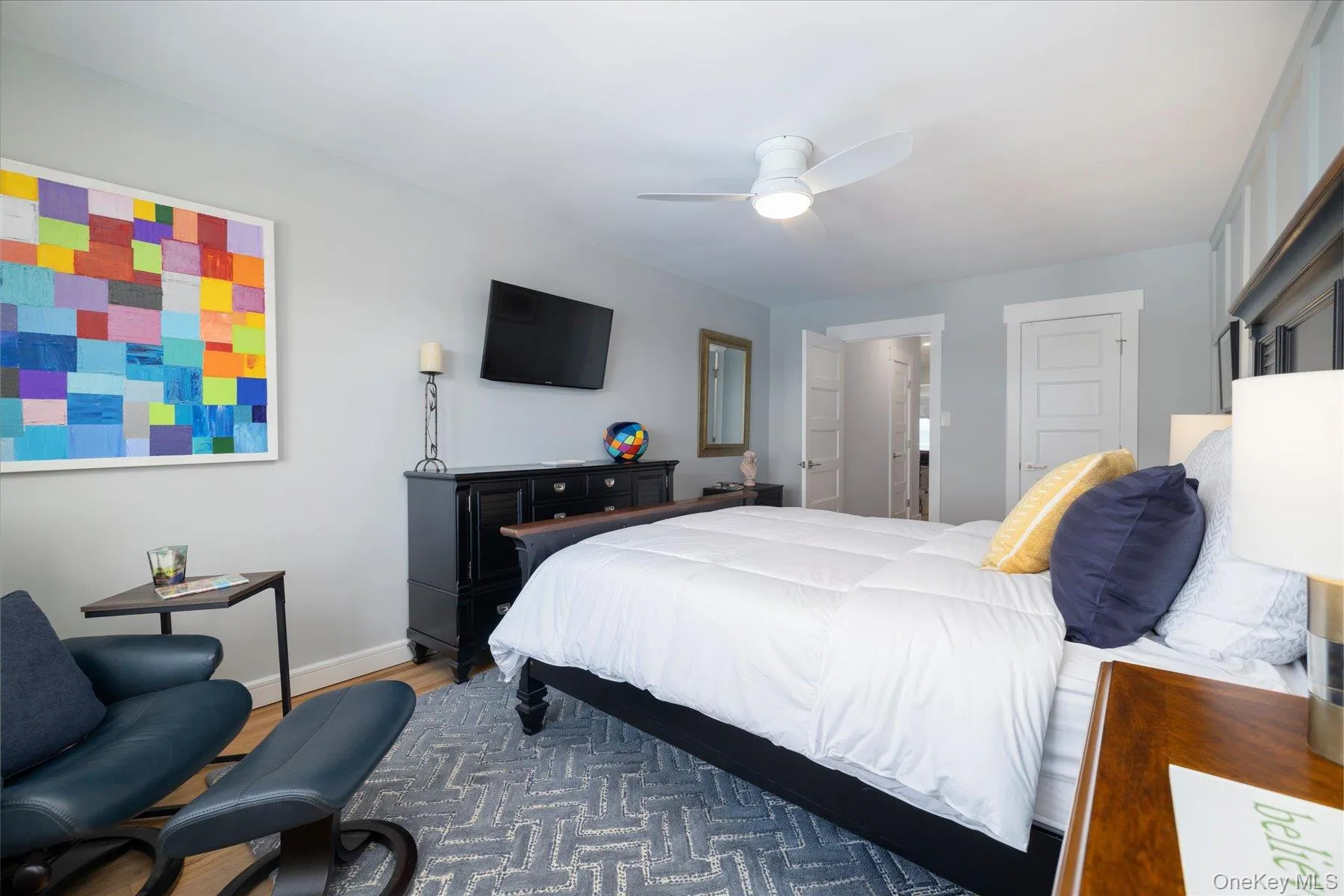 Oversized bedroom with hardwood floors, recessed lighting, and walk-in closet Oversized bedroom with hardwood floors, recessed lighting, and walk-in closet