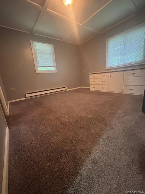 Primary bedroom with newer carpet and built-ins Primary bedroom with newer carpet and built-ins