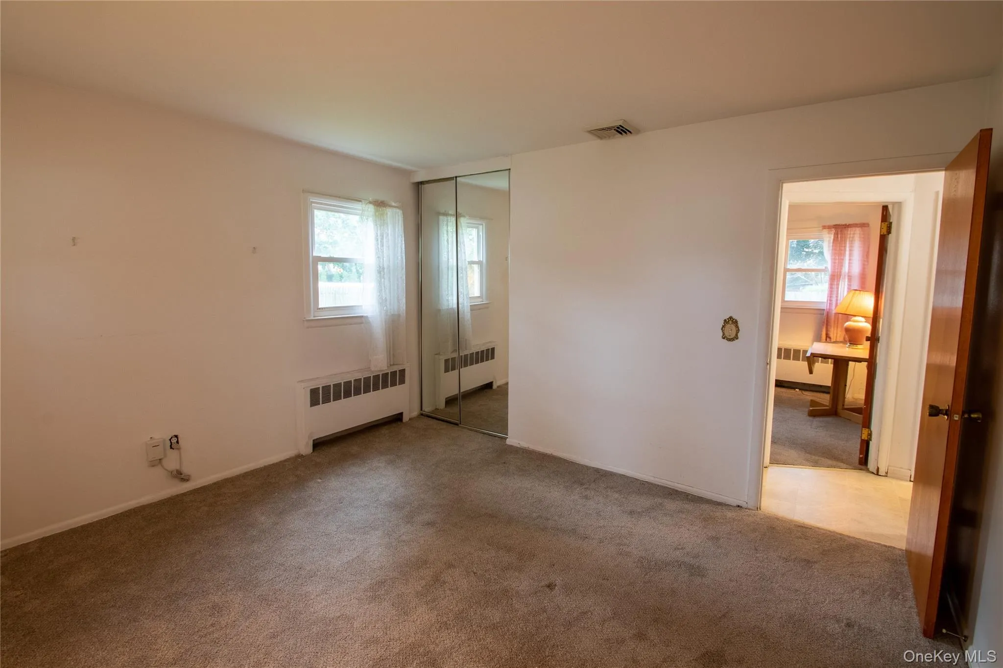 Wall-to-wall carpeting and neutral wall paint Wall-to-wall carpeting and neutral wall paint