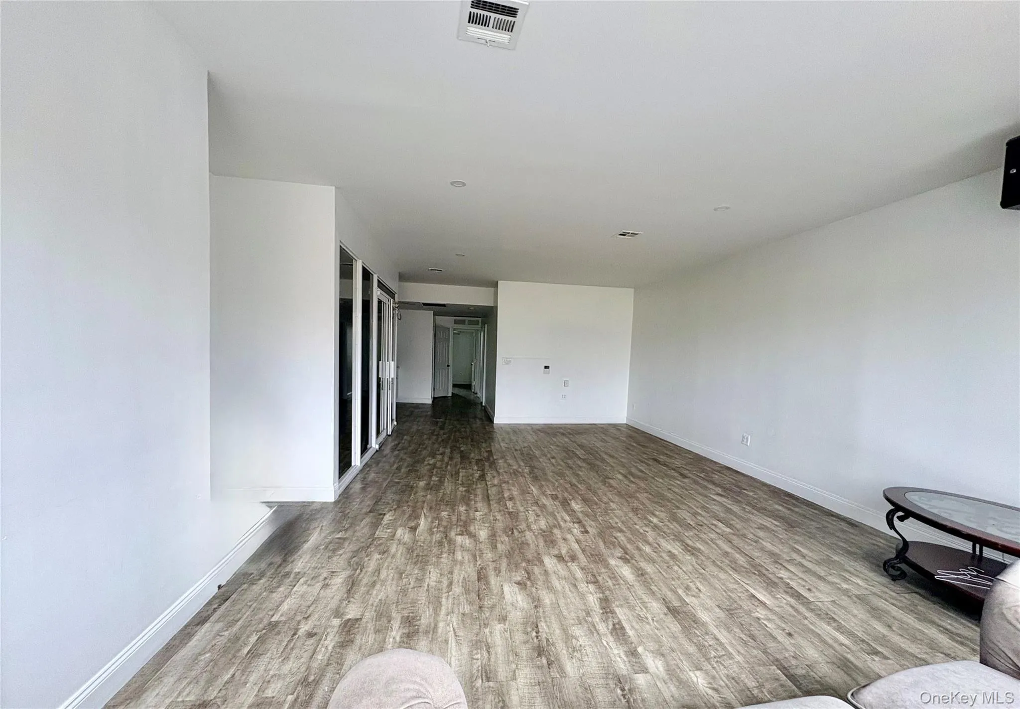 Spacious open-concept commercial area featuring modern flooring and a versatile layout ideal for a wide range of business uses. Spacious open-concept commercial area featuring modern flooring and a versatile layout ideal for a wide range of business uses.