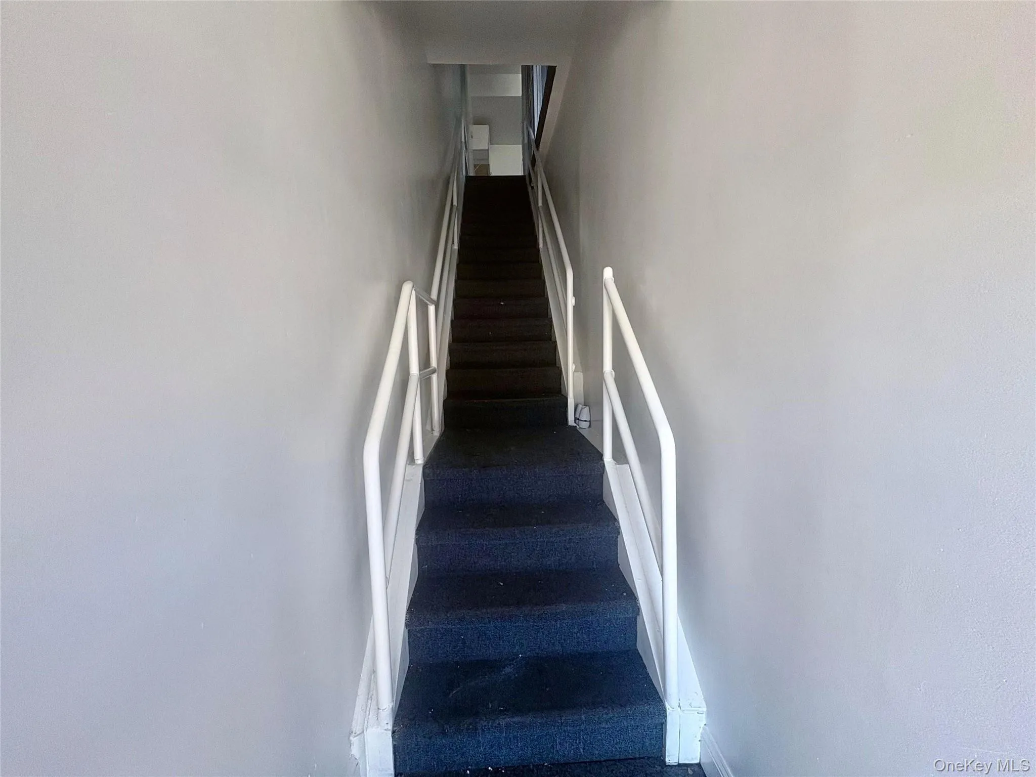 Private staircase leading to the 2nd floor commercial space with secure interior access. Private staircase leading to the 2nd floor commercial space with secure interior access.