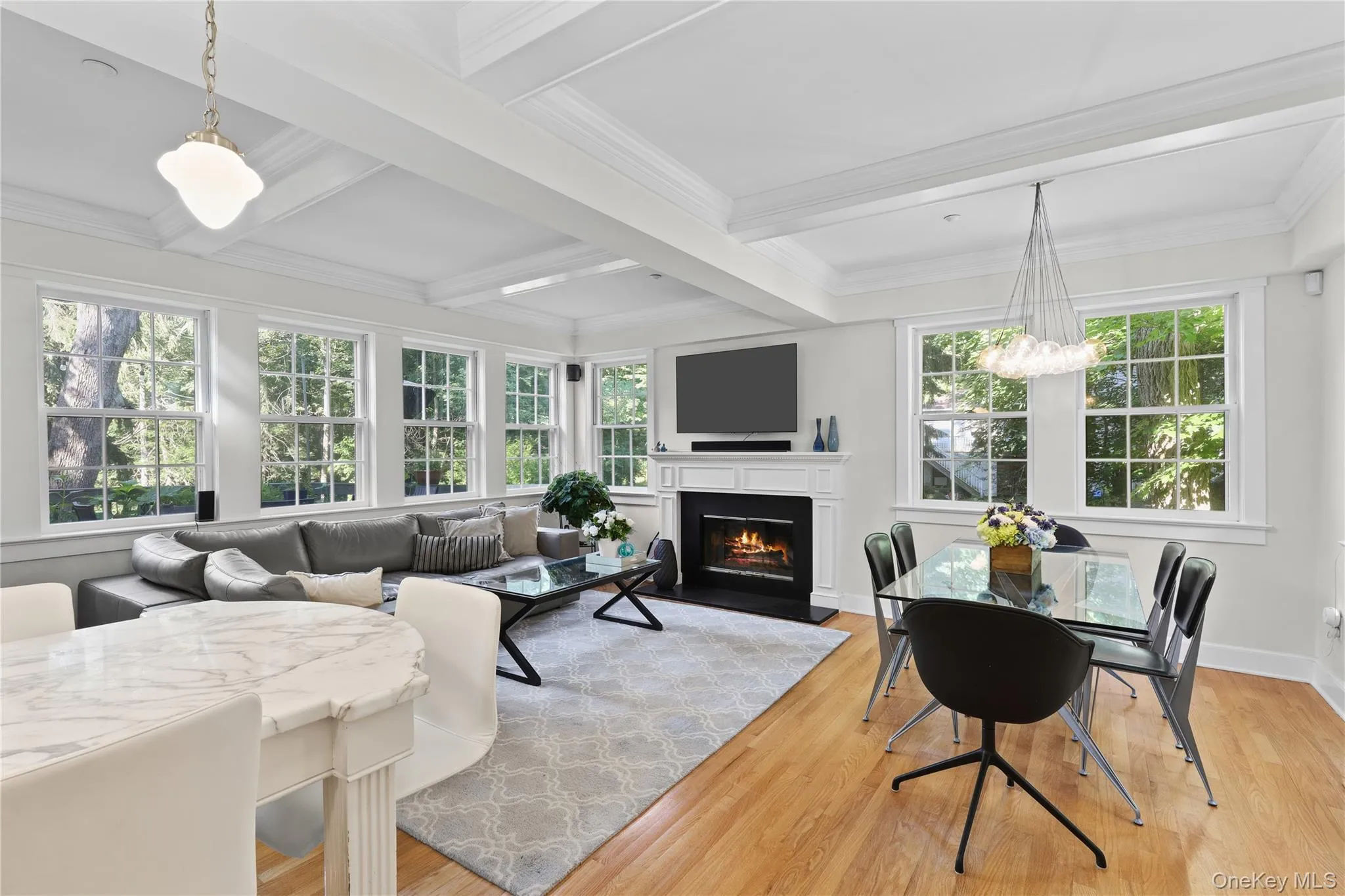 Open-concept Family room with 2nd fireplace, coffered ceilings and doors out to deck. Open-concept Family room with 2nd fireplace, coffered ceilings and doors out to deck.