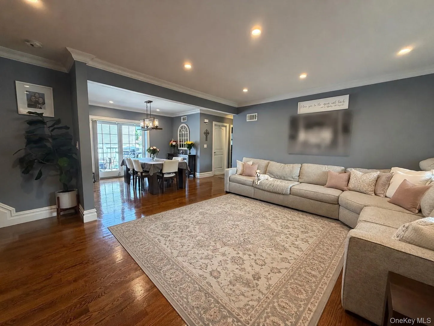 Spacious living room open to dining room and kitchen. Spacious living room open to dining room and kitchen.