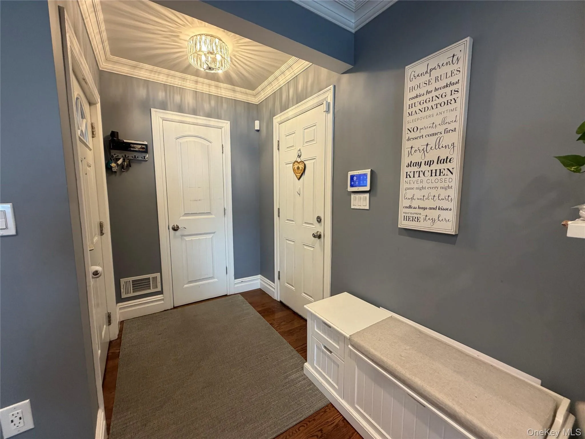 Entry way with coat closet and access to garage from the house. Entry way with coat closet and access to garage from the house.