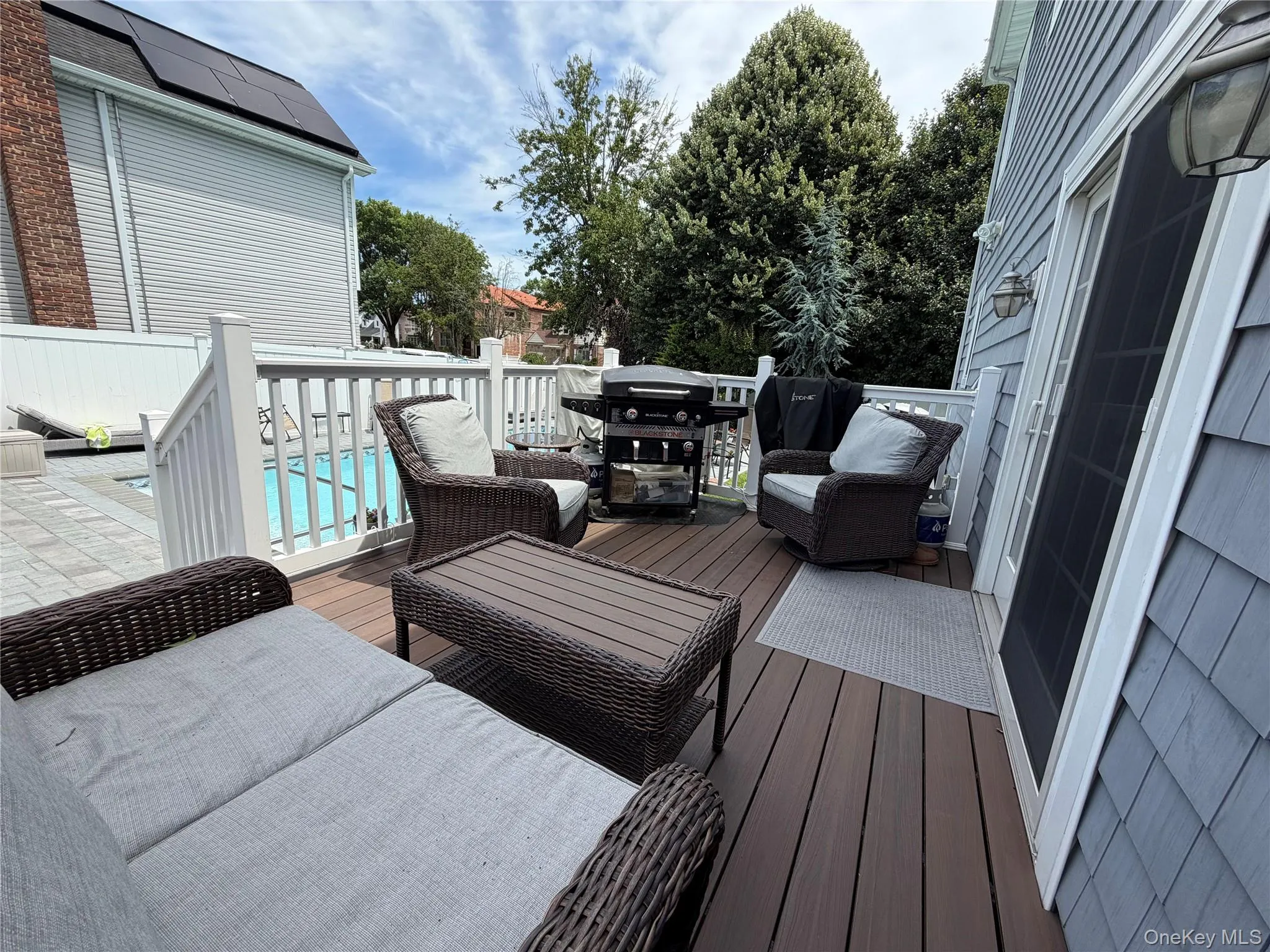 Back deck overlooking your backyard oasis Back deck overlooking your backyard oasis
