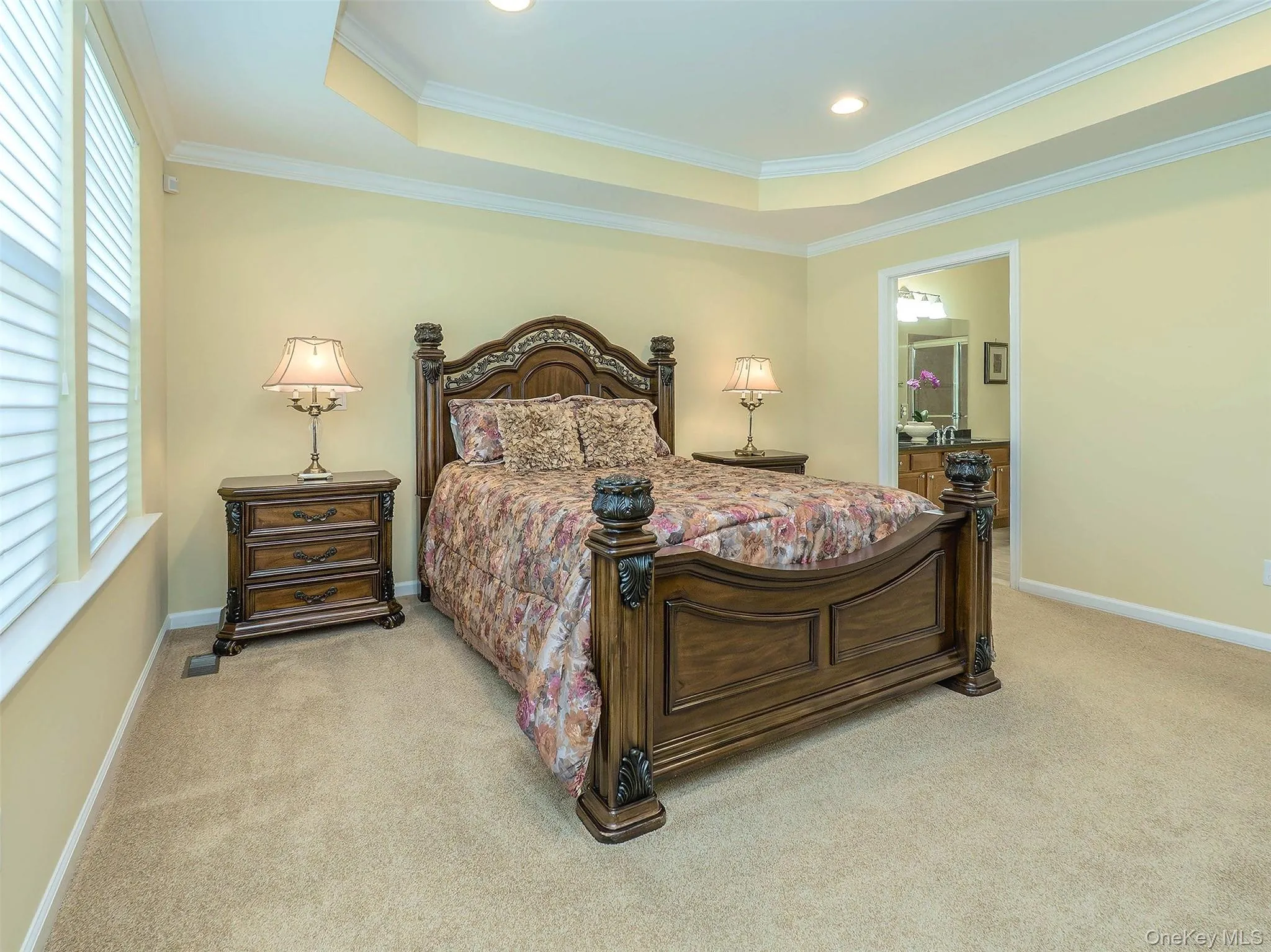 Large Primary Bedroom, with tray ceiling, with recessed lighting and woodwork. Large Primary Bedroom, with tray ceiling, with recessed lighting and woodwork.