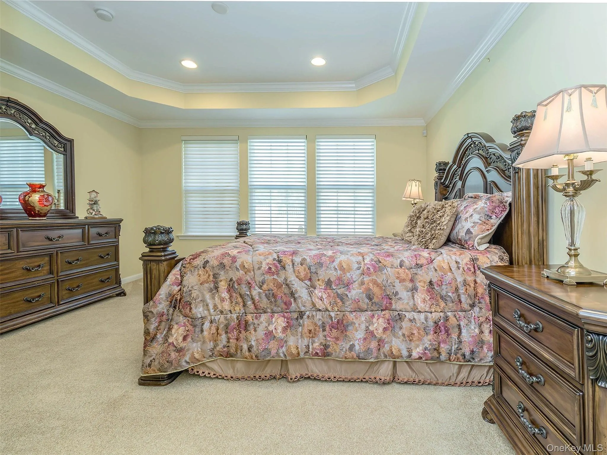 Primary Bedroom with soft carpet and large windows. Primary Bedroom with soft carpet and large windows.