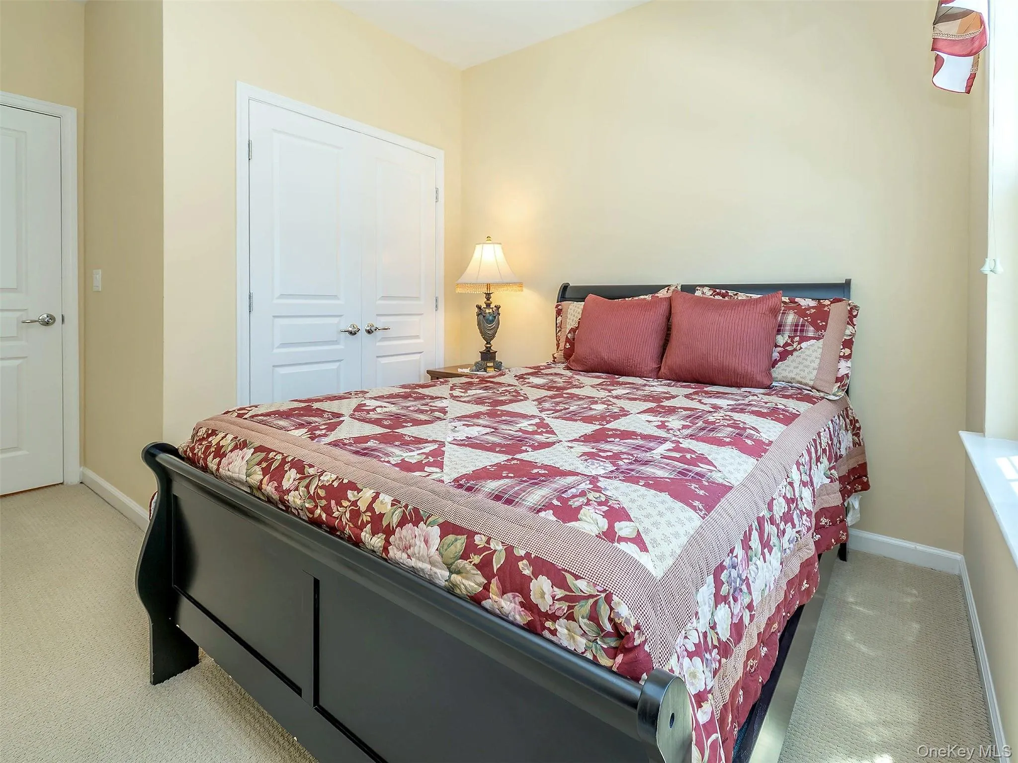 Bright Bedroom with double door closet access. Bright Bedroom with double door closet access.