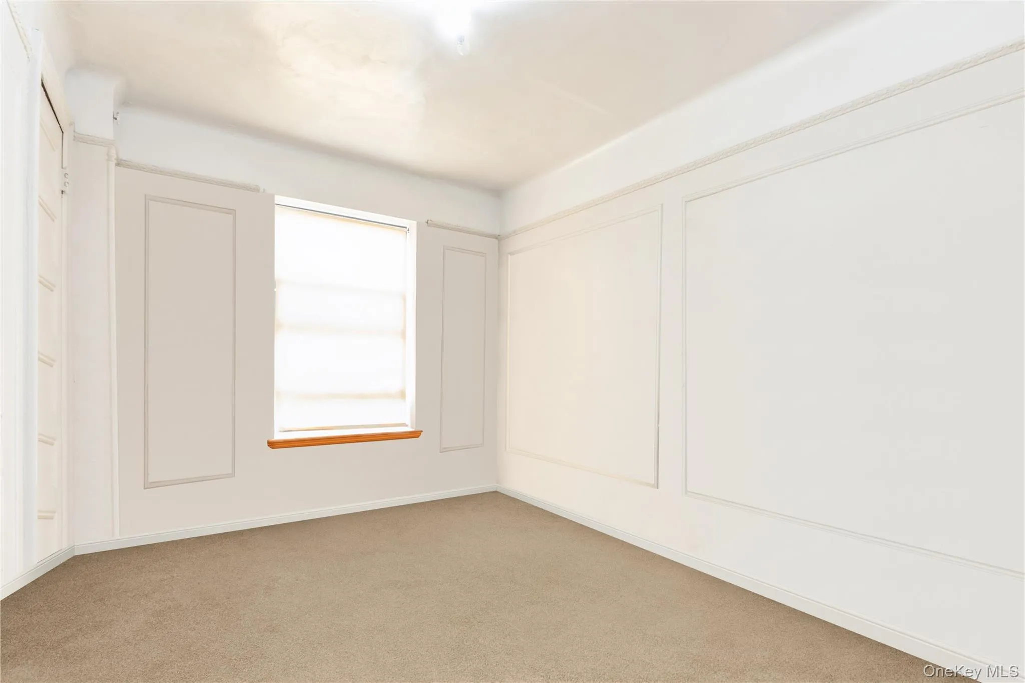 Unfurnished room featuring light colored carpet - Virtually Edited Unfurnished room featuring light colored carpet - Virtually Edited