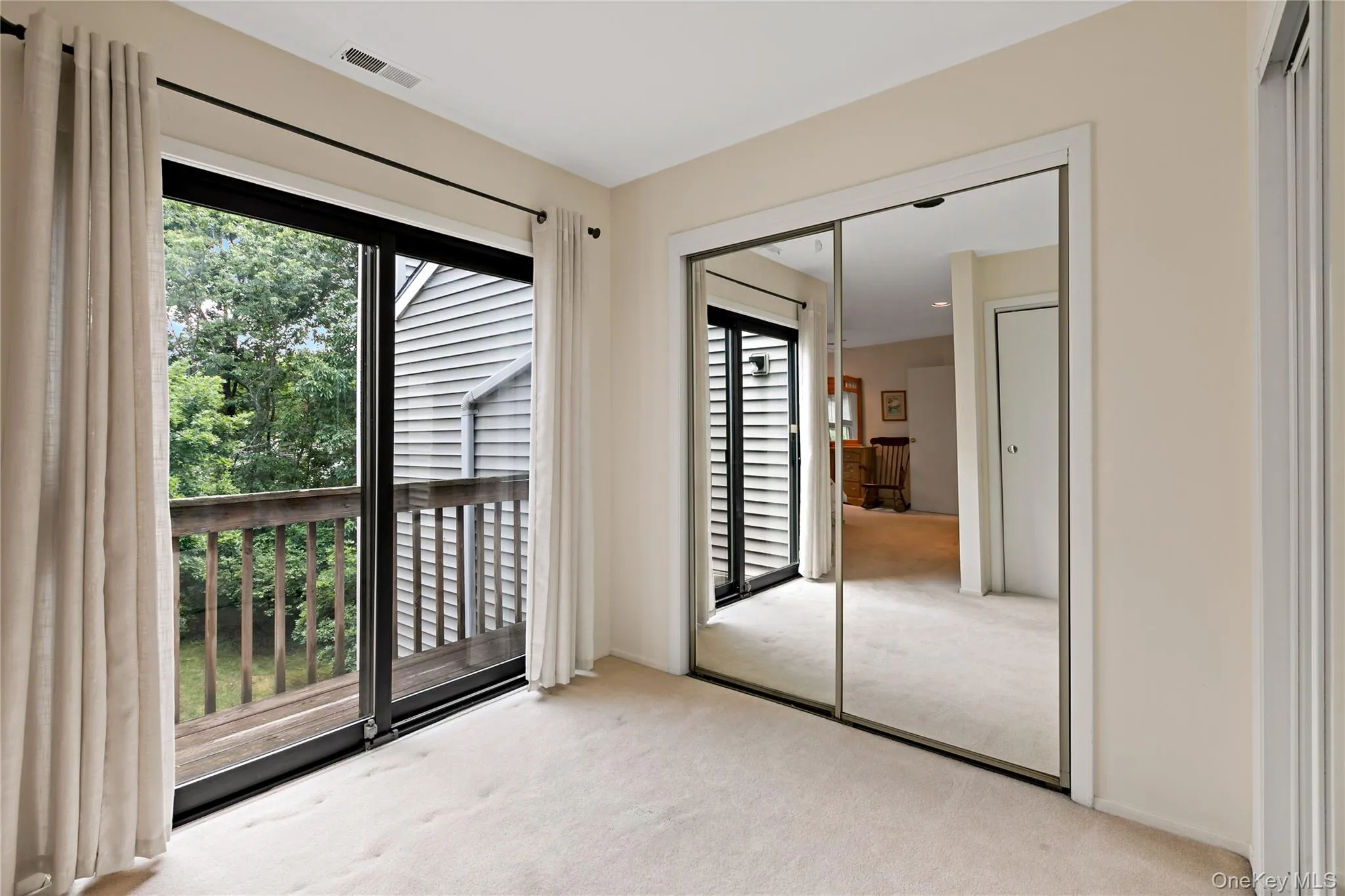 Dressing Area with Multiple Closets & Balcony. Dressing Area with Multiple Closets & Balcony.