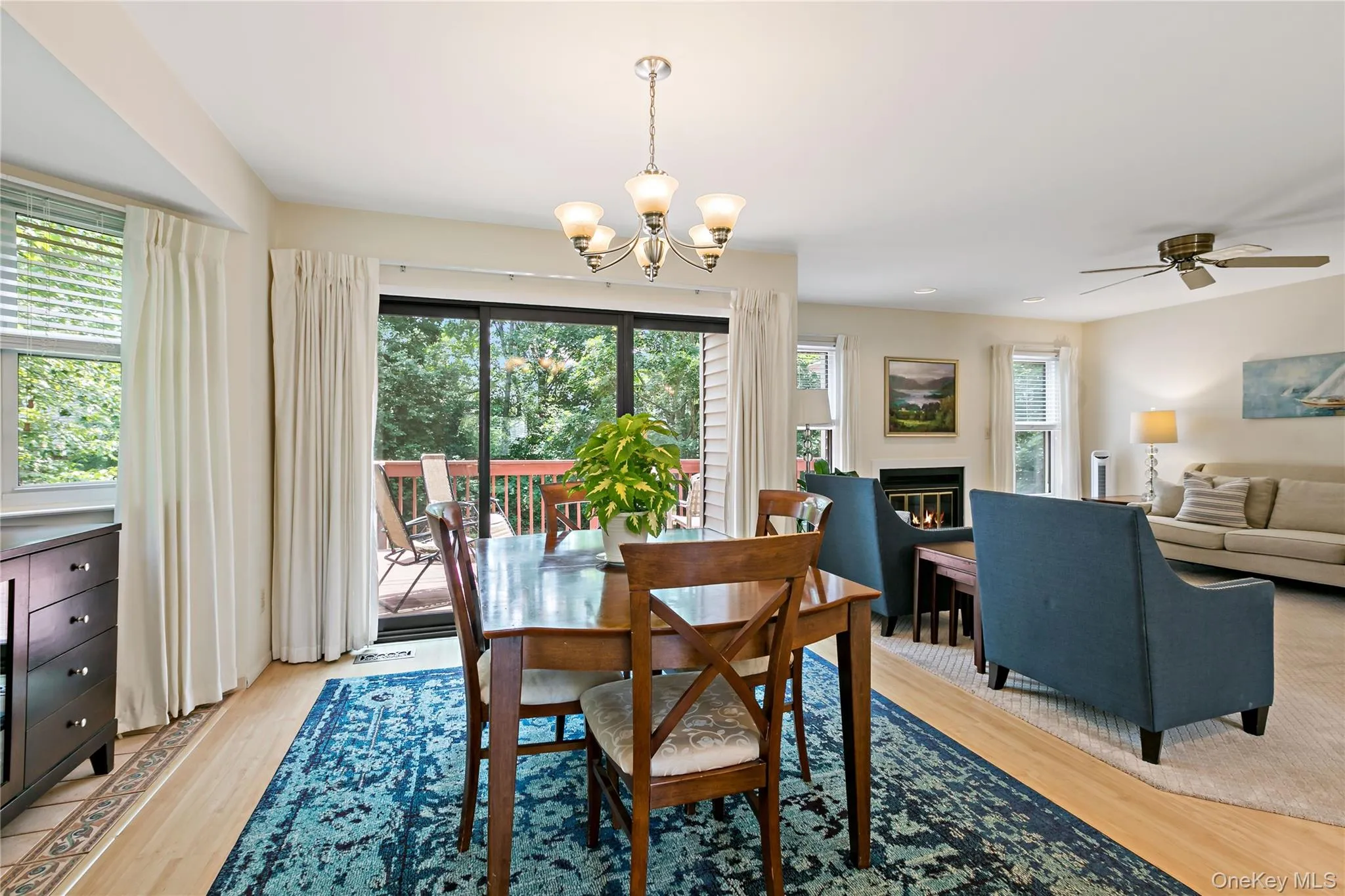 Dining Room with Sliders to Expansive Deck with Pretty Views and Stairs to Grassy Area. Dining Room with Sliders to Expansive Deck with Pretty Views and Stairs to Grassy Area.