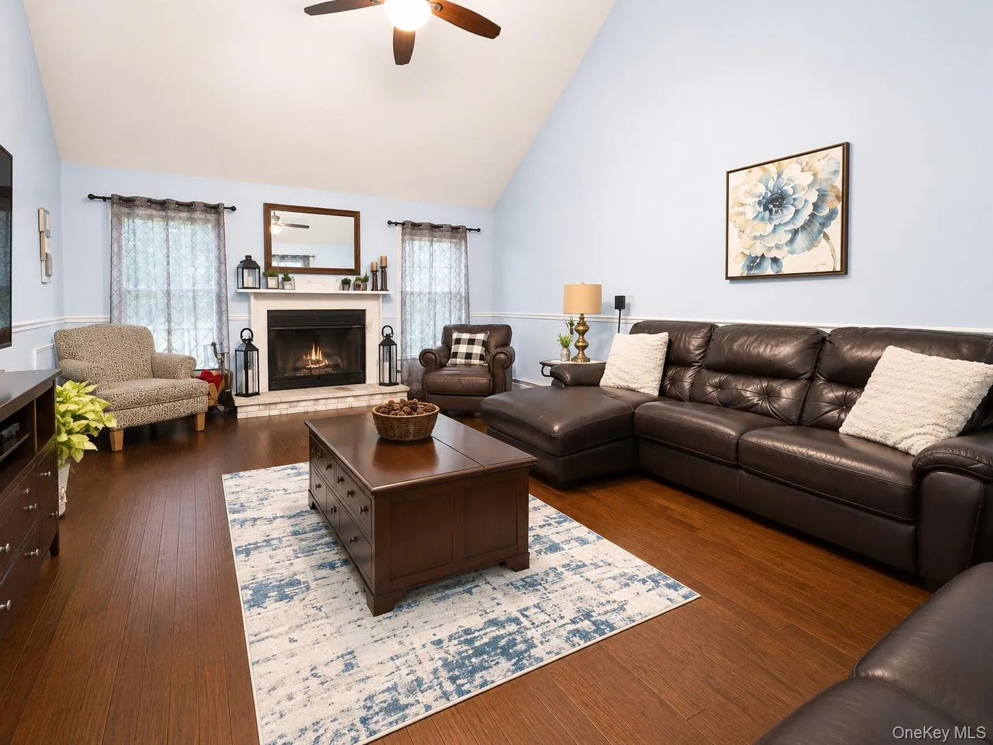 with a fireplace and vaulted ceiling with a fireplace and vaulted ceiling