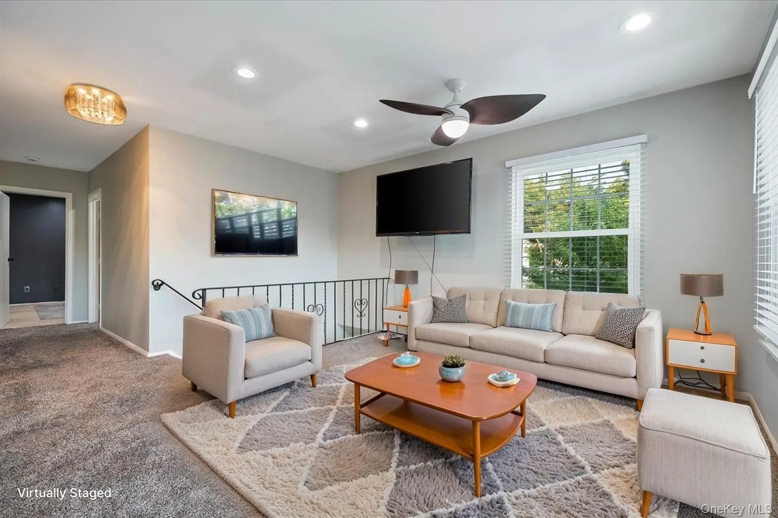 Open concept living space featuring neutral gray walls, recessed lighting, and a ceiling fan Open concept living space featuring neutral gray walls, recessed lighting, and a ceiling fan
