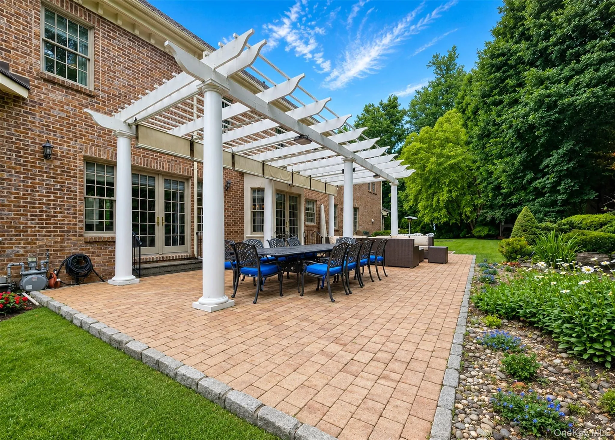 Patio Surrounded by Koi Pond with Waterfalls Patio Surrounded by Koi Pond with Waterfalls