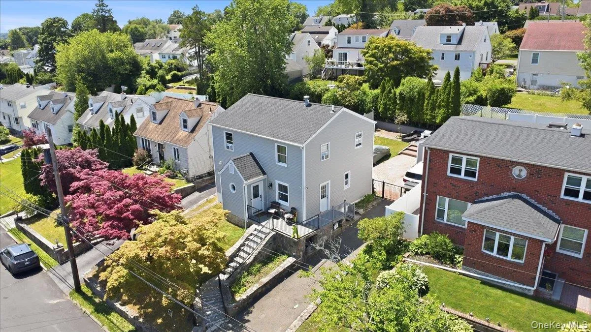 Two-story siding exterior with multiple windows Two-story siding exterior with multiple windows