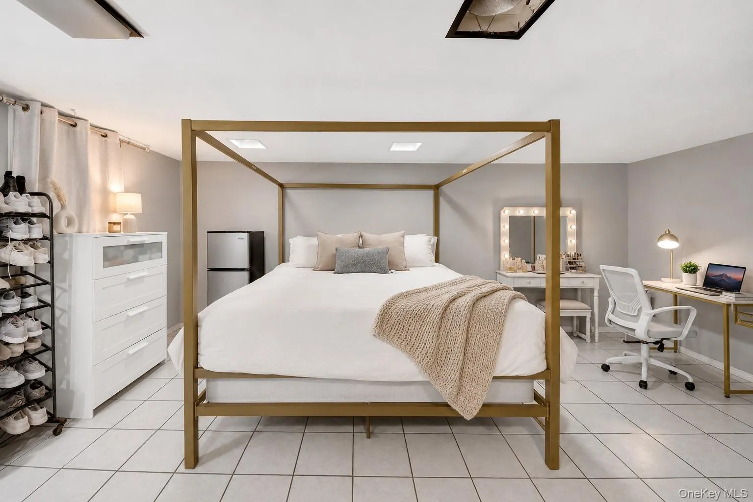 Spacious room featuring light-toned tile flooring, recessed ceiling lighting, and neutral wall paint Spacious room featuring light-toned tile flooring, recessed ceiling lighting, and neutral wall paint