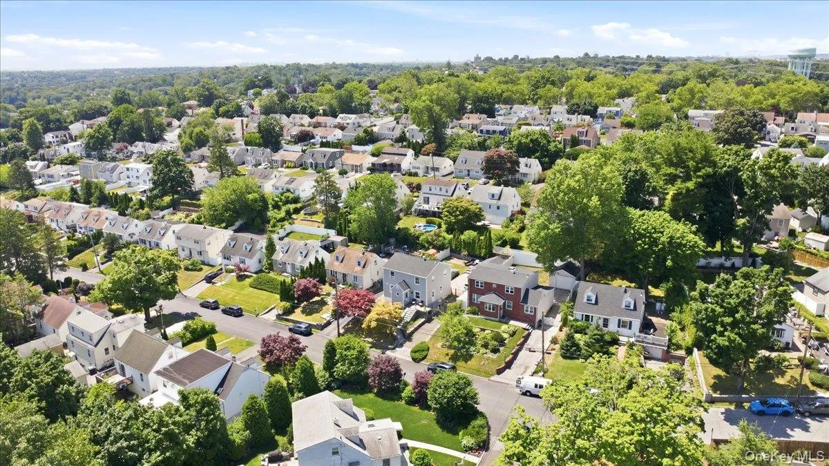 Expansive residential neighborhood with mature trees and varied housing styles Expansive residential neighborhood with mature trees and varied housing styles