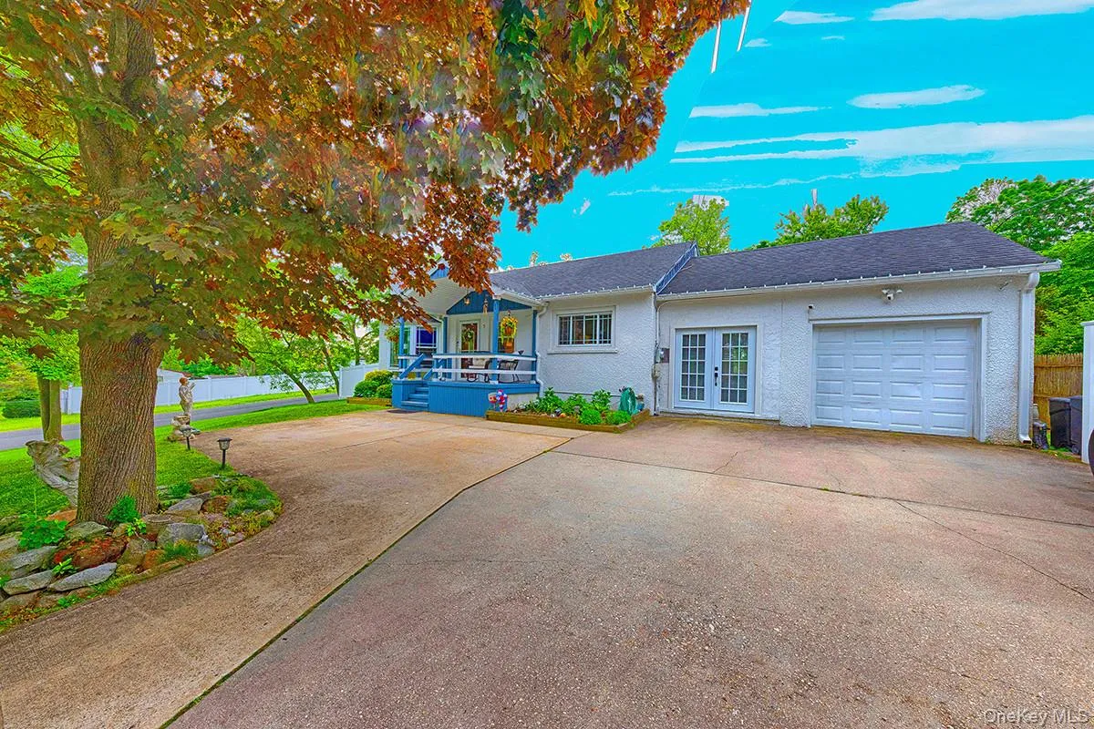 Front of house with the driveway and garage Front of house with the driveway and garage