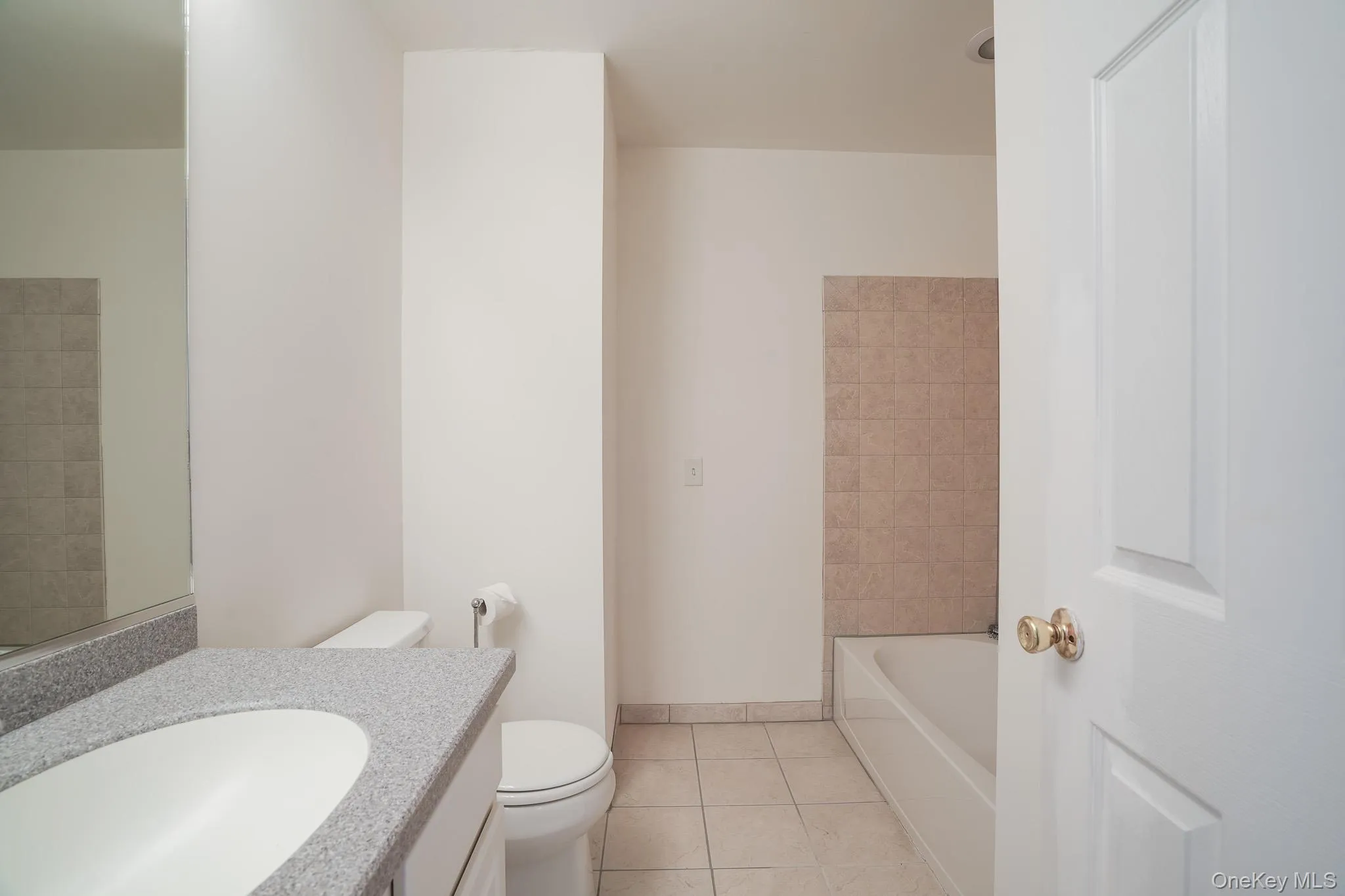 Upper level hall bath featuring vanity sink and tub/shower combo Upper level hall bath featuring vanity sink and tub/shower combo
