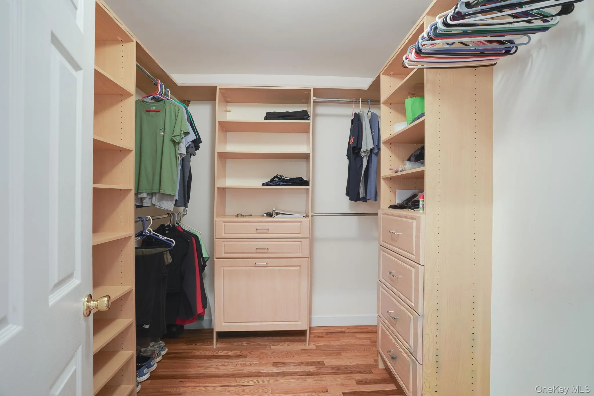 Primary walk-in closet (virtually staged) Primary walk-in closet (virtually staged)