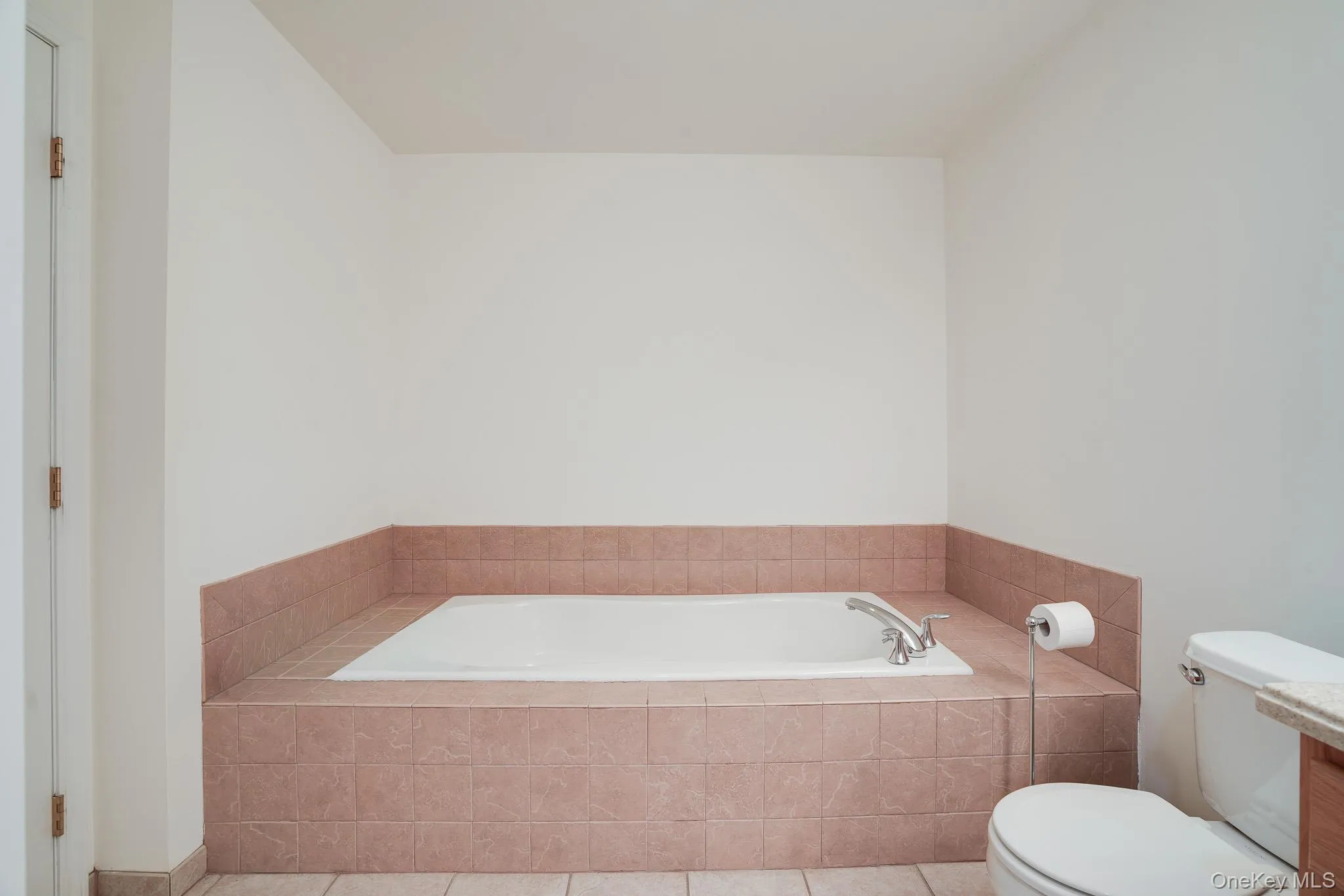 Primary bath featuring large soaking tub Primary bath featuring large soaking tub