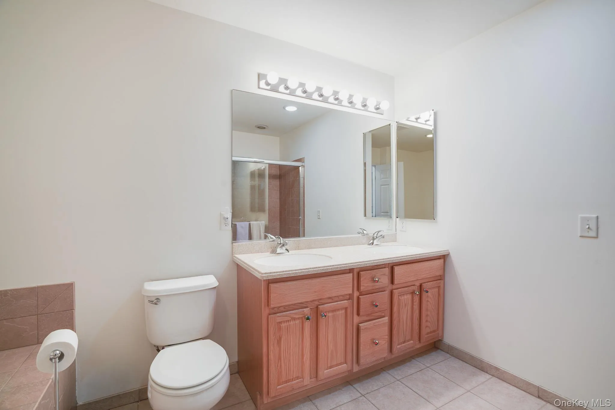 Primary bath featuring double vanity sinks Primary bath featuring double vanity sinks