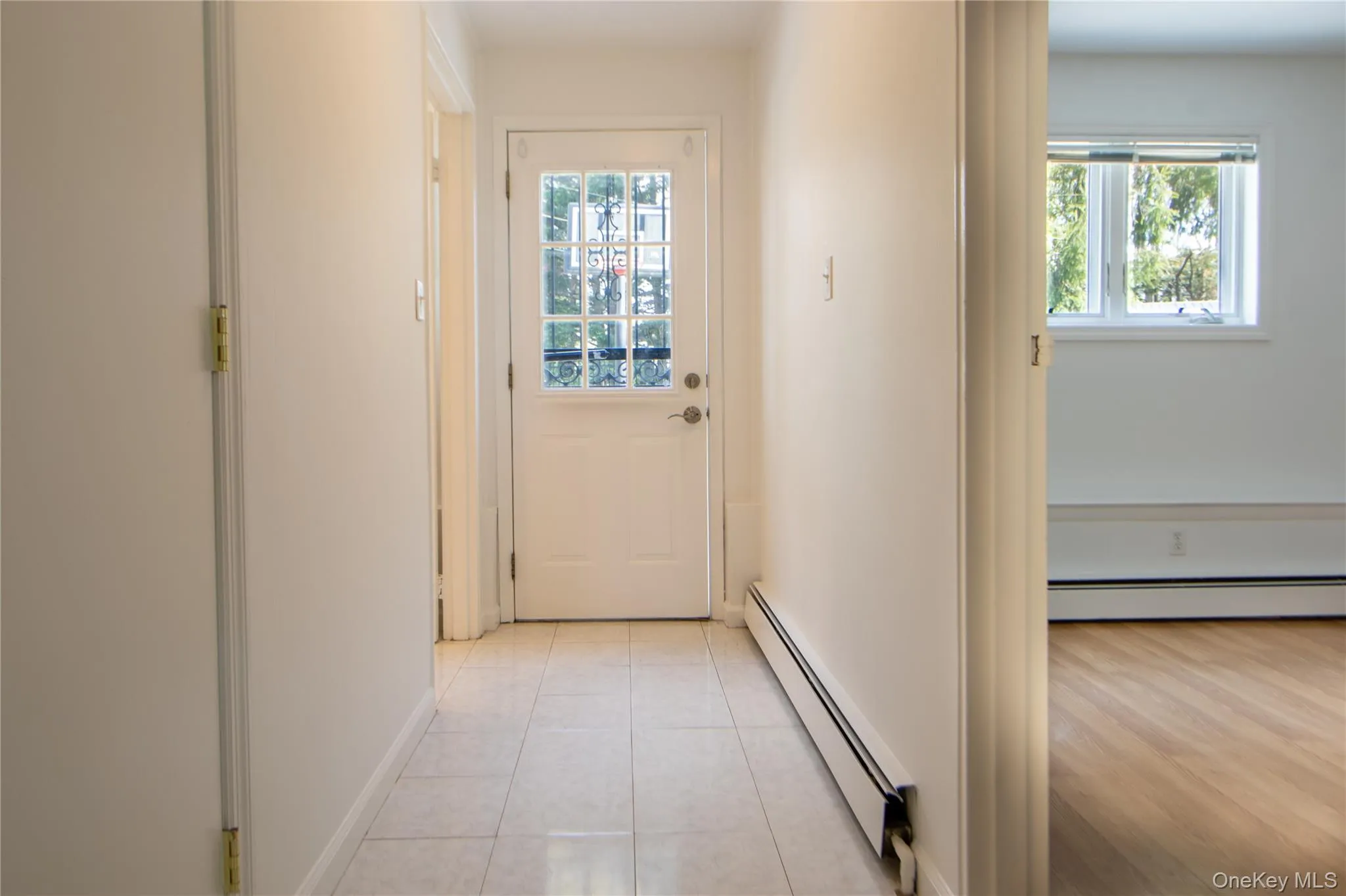 Entryway featuring light tile patterned floors Entryway featuring light tile patterned floors