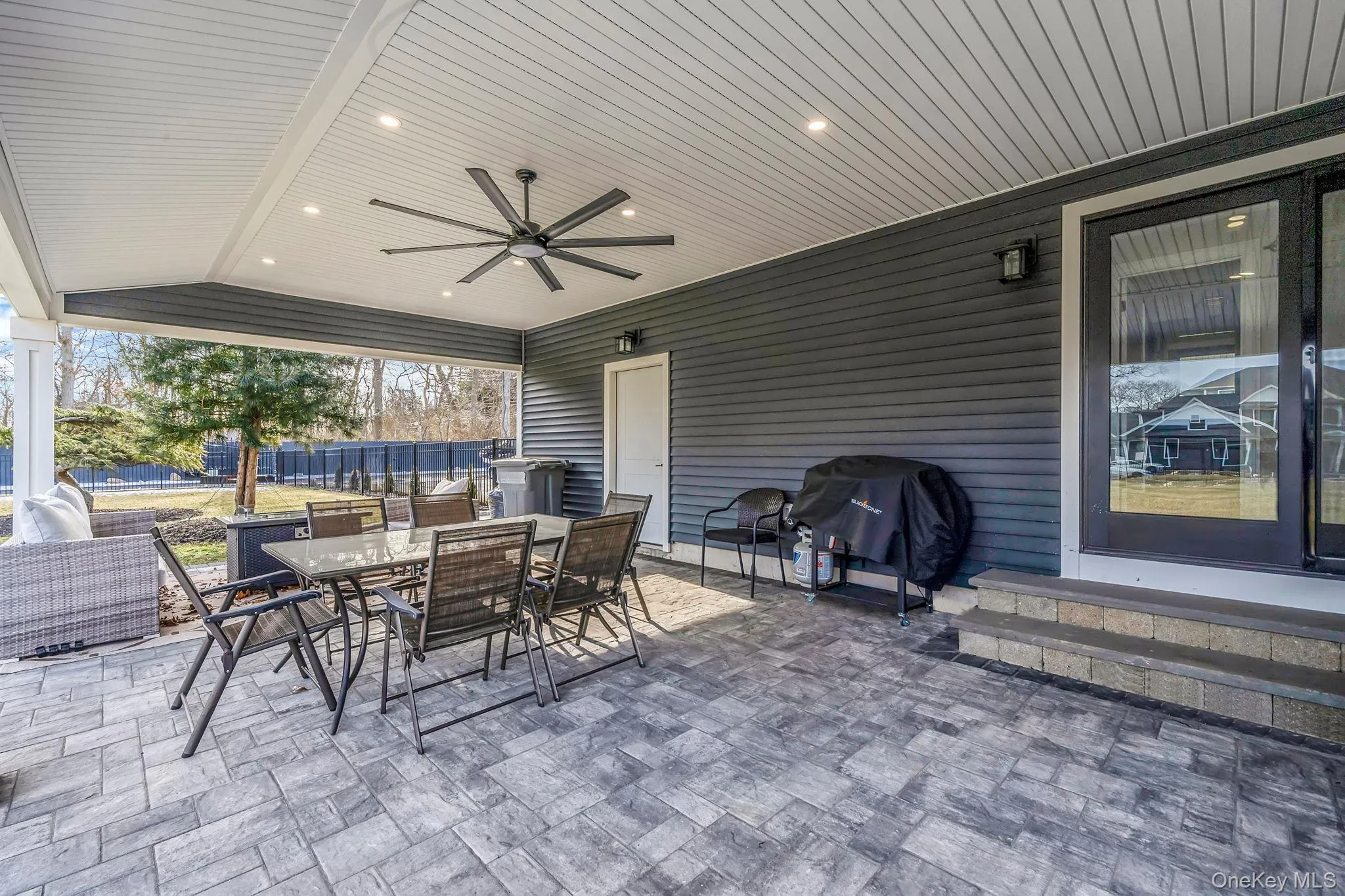 Covered Porch that has access door to Garage - Pavers Covered Porch that has access door to Garage - Pavers