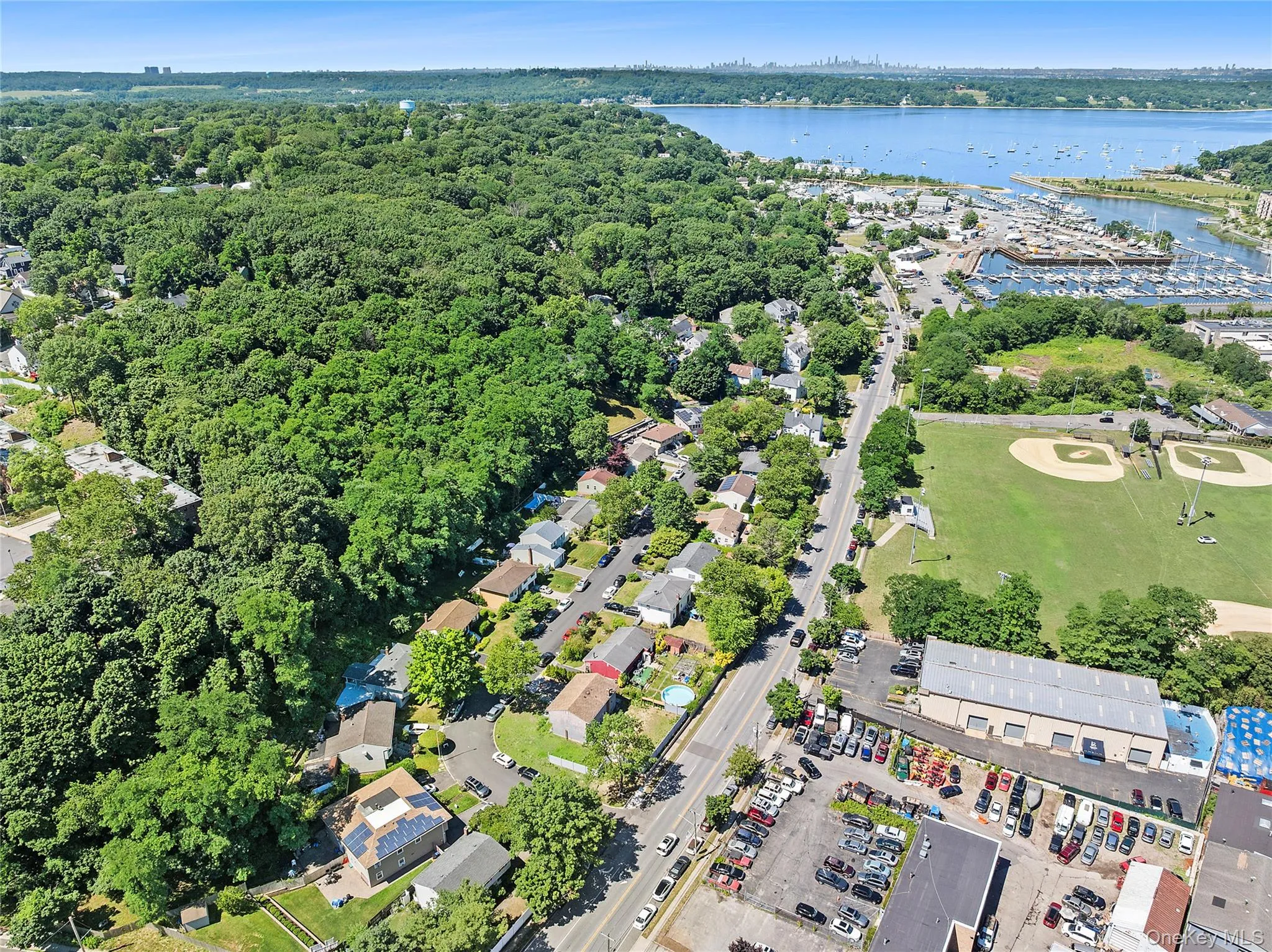 Aerial perspective showcasing surrounding natural elements and nearby amenities Aerial perspective showcasing surrounding natural elements and nearby amenities
