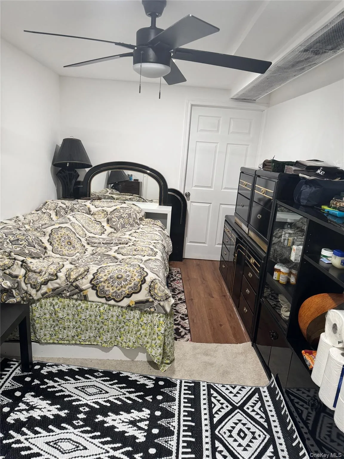 Bedroom featuring wood finished floors and ceiling fan Bedroom featuring wood finished floors and ceiling fan