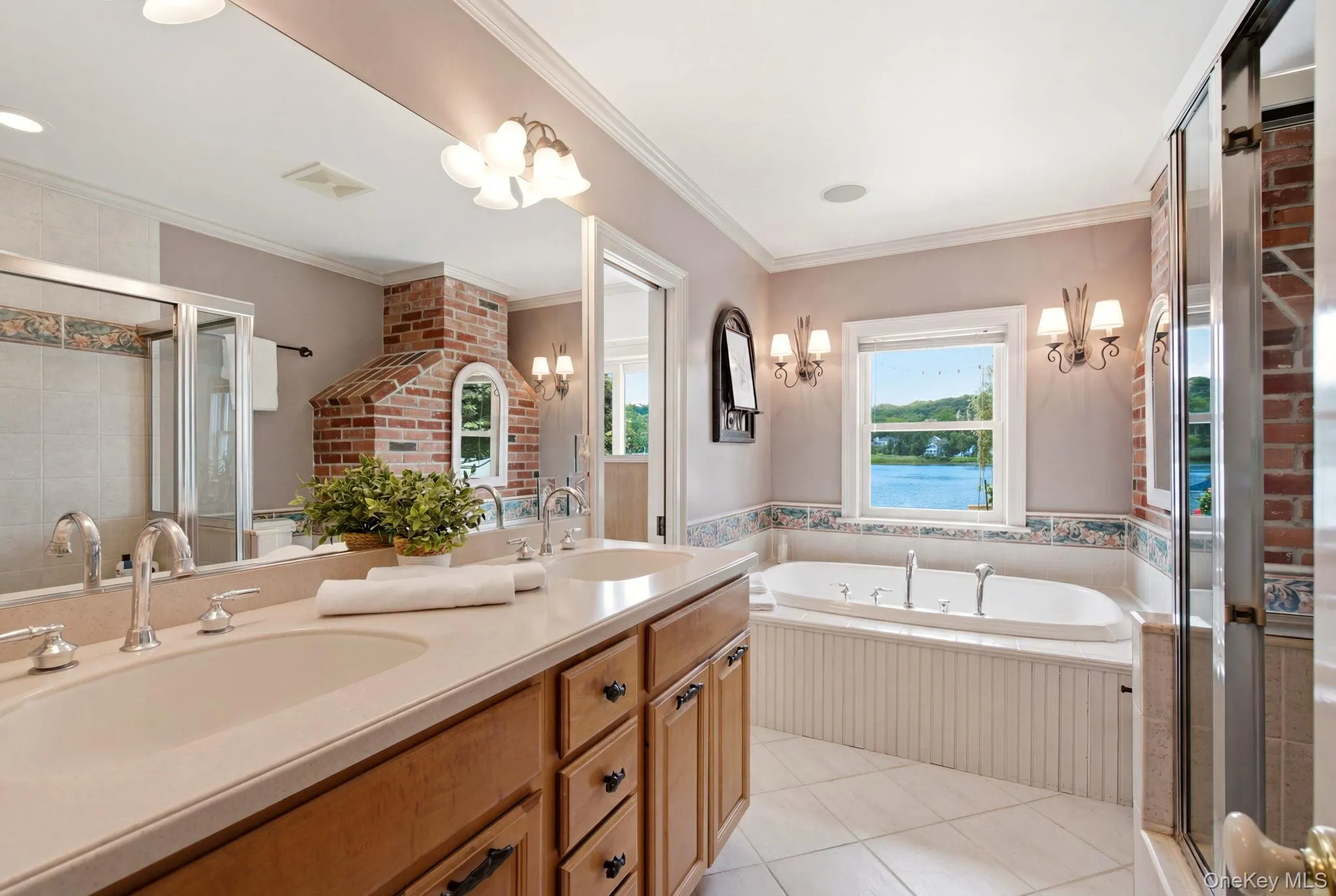 Primary bath with double vanity, shower and tub. Primary bath with double vanity, shower and tub.
