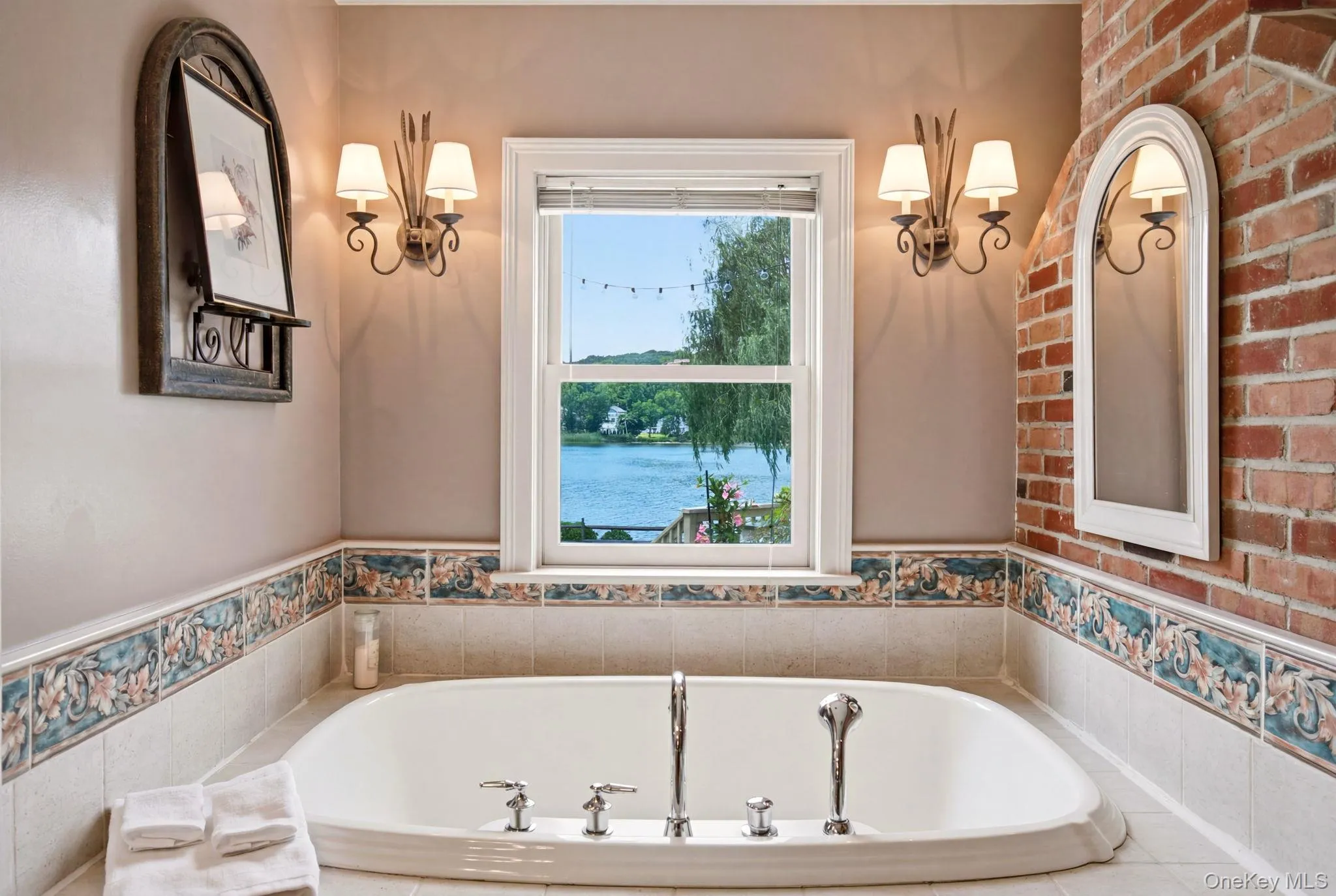Soaking tub with views of the pond. Soaking tub with views of the pond.